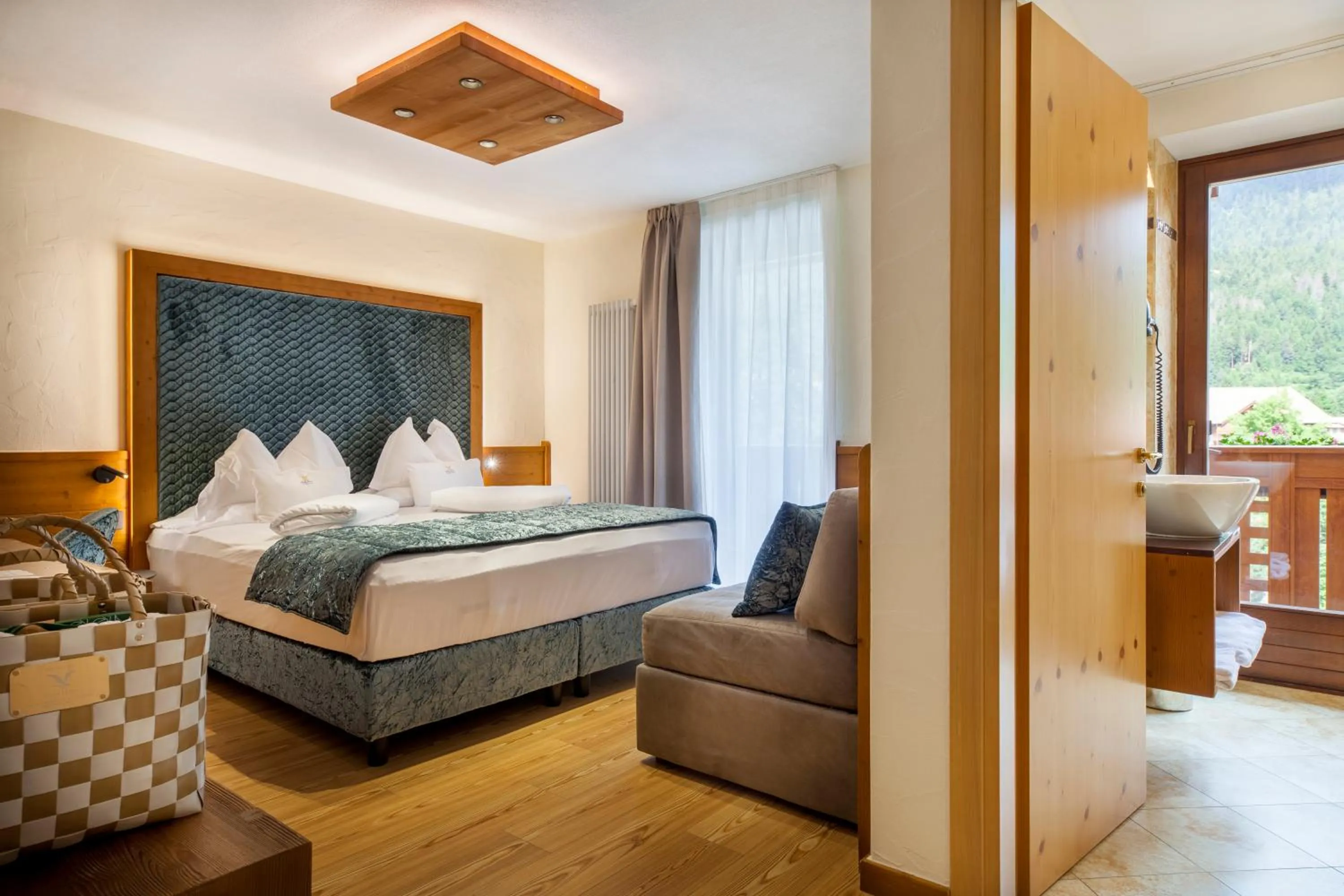 Bed in ADLER MERYEM wellness hotel - Andalo