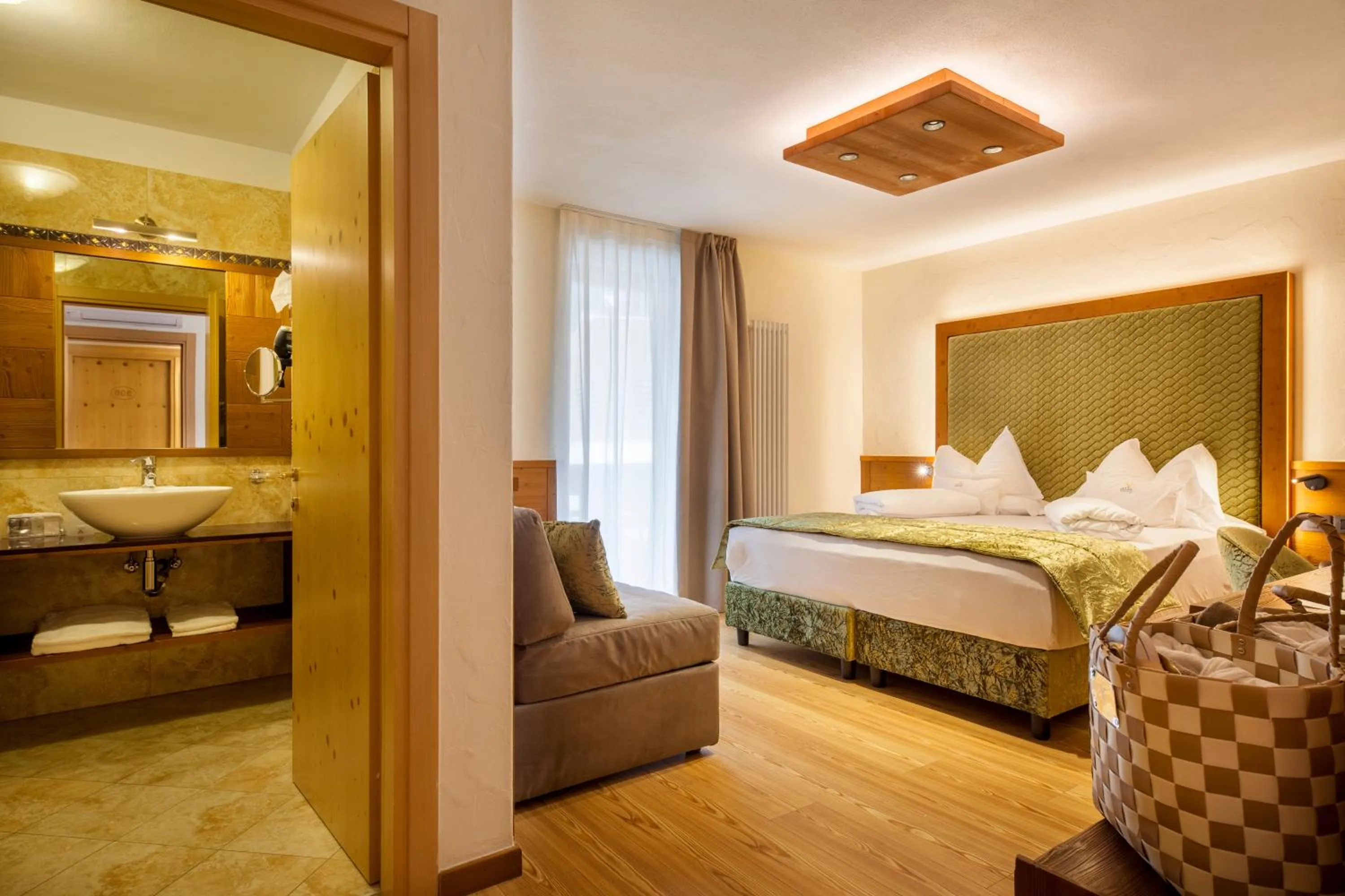 Bed in ADLER MERYEM wellness hotel - Andalo