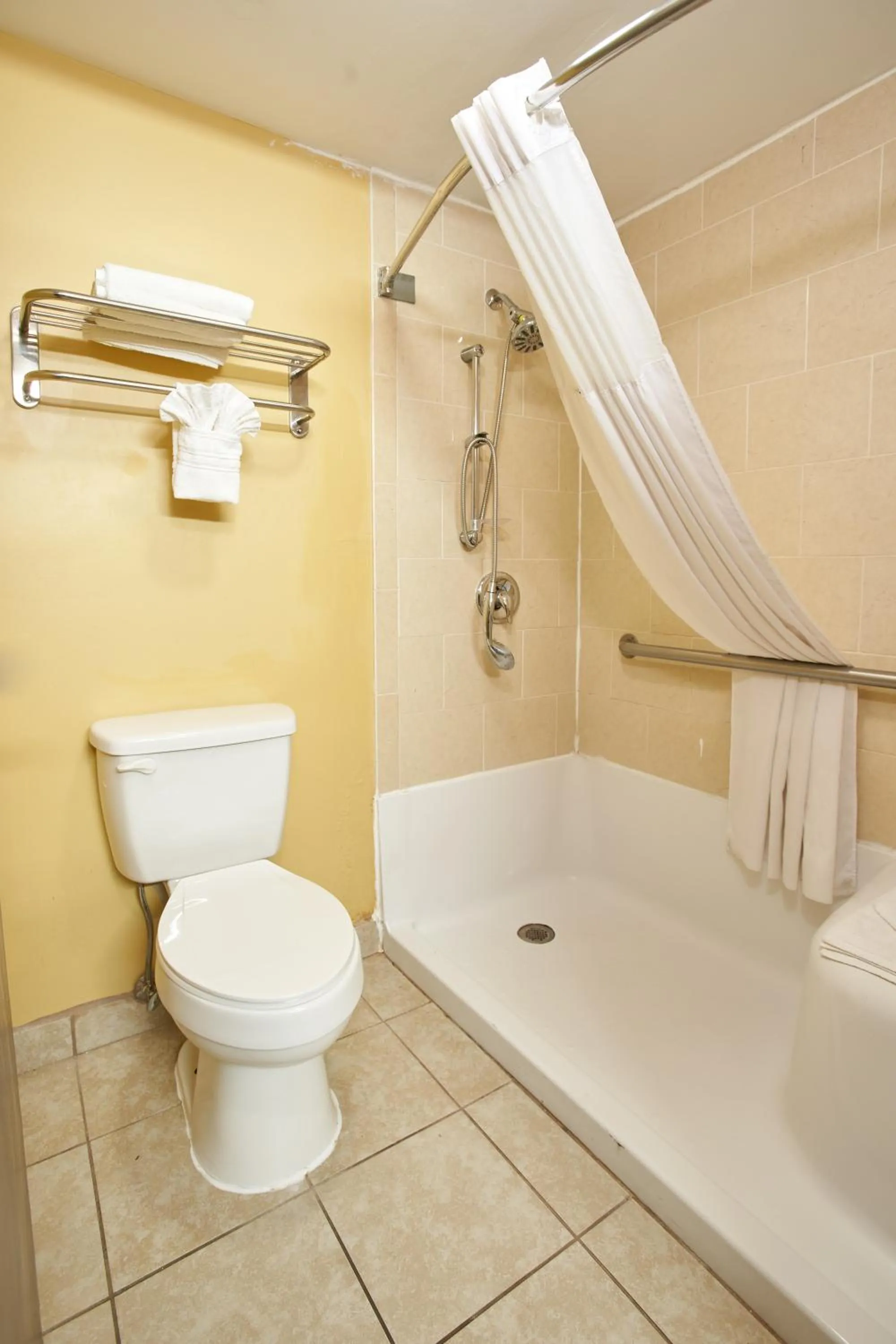 Toilet in Super 8 by Wyndham Wichita Airport West Kellogg