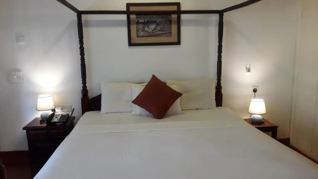 Bed in Reef Garden Hotel