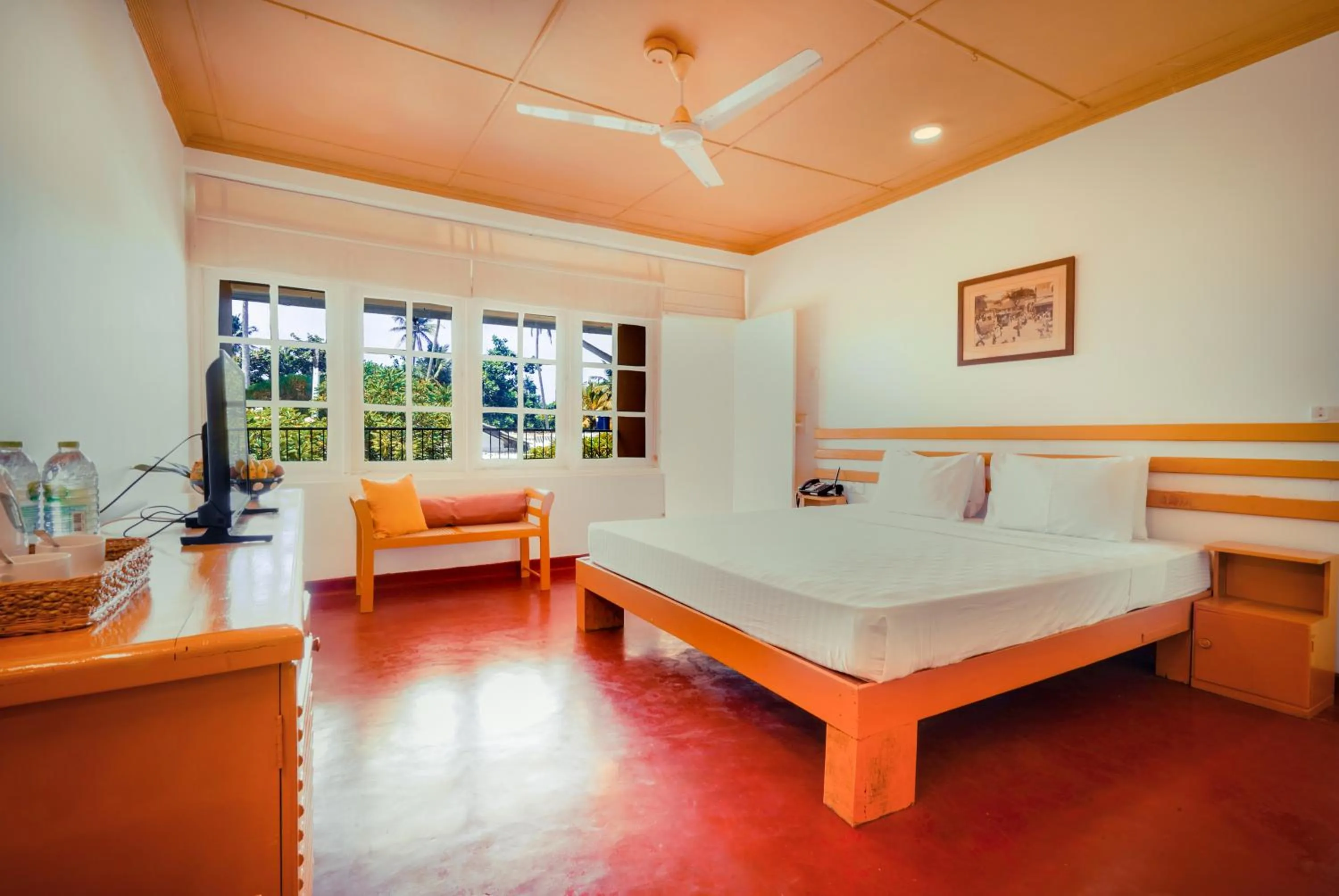 Bed in Reef Garden Hotel