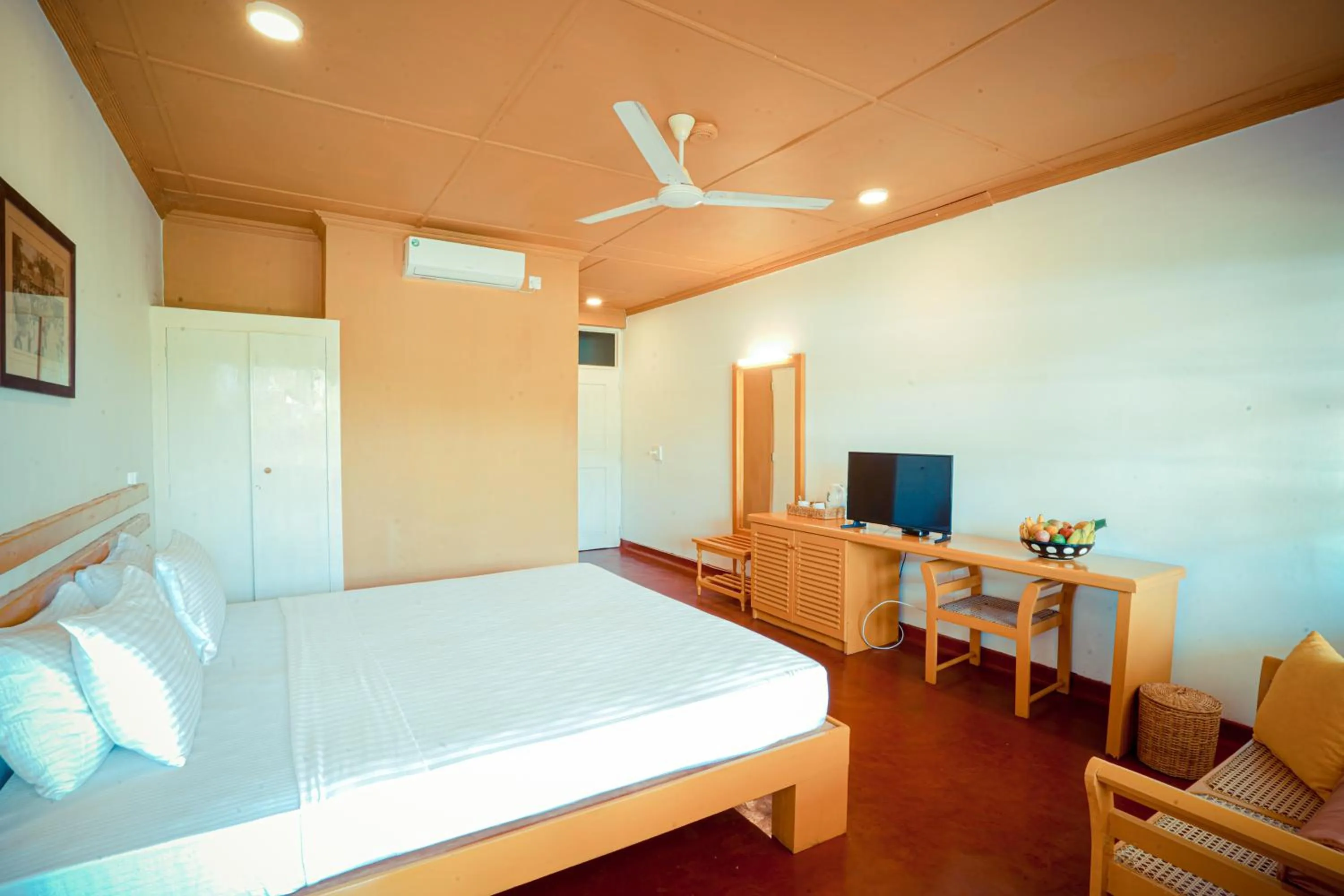 Bed in Reef Garden Hotel