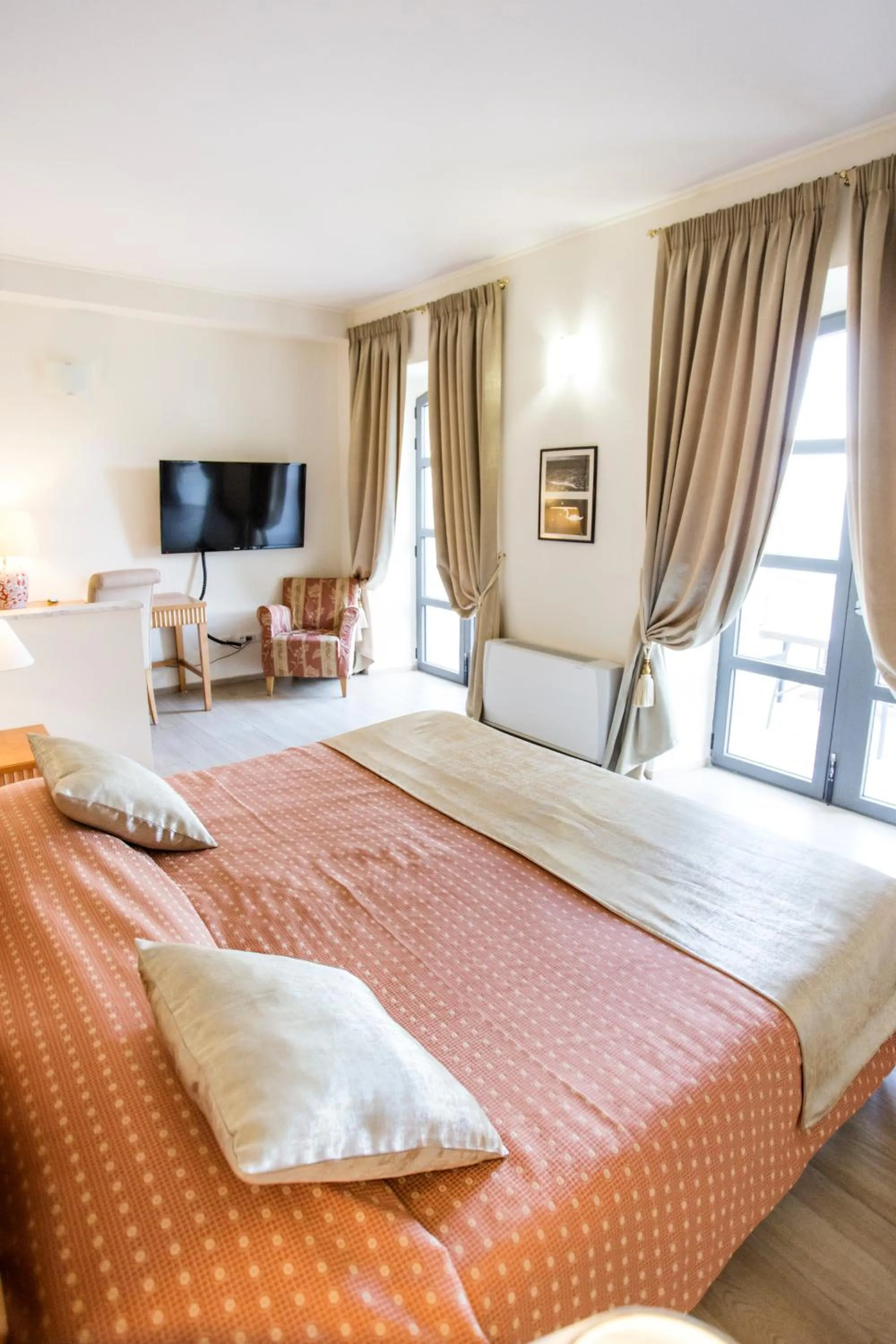 Bed in Miramare Apartments&Suites