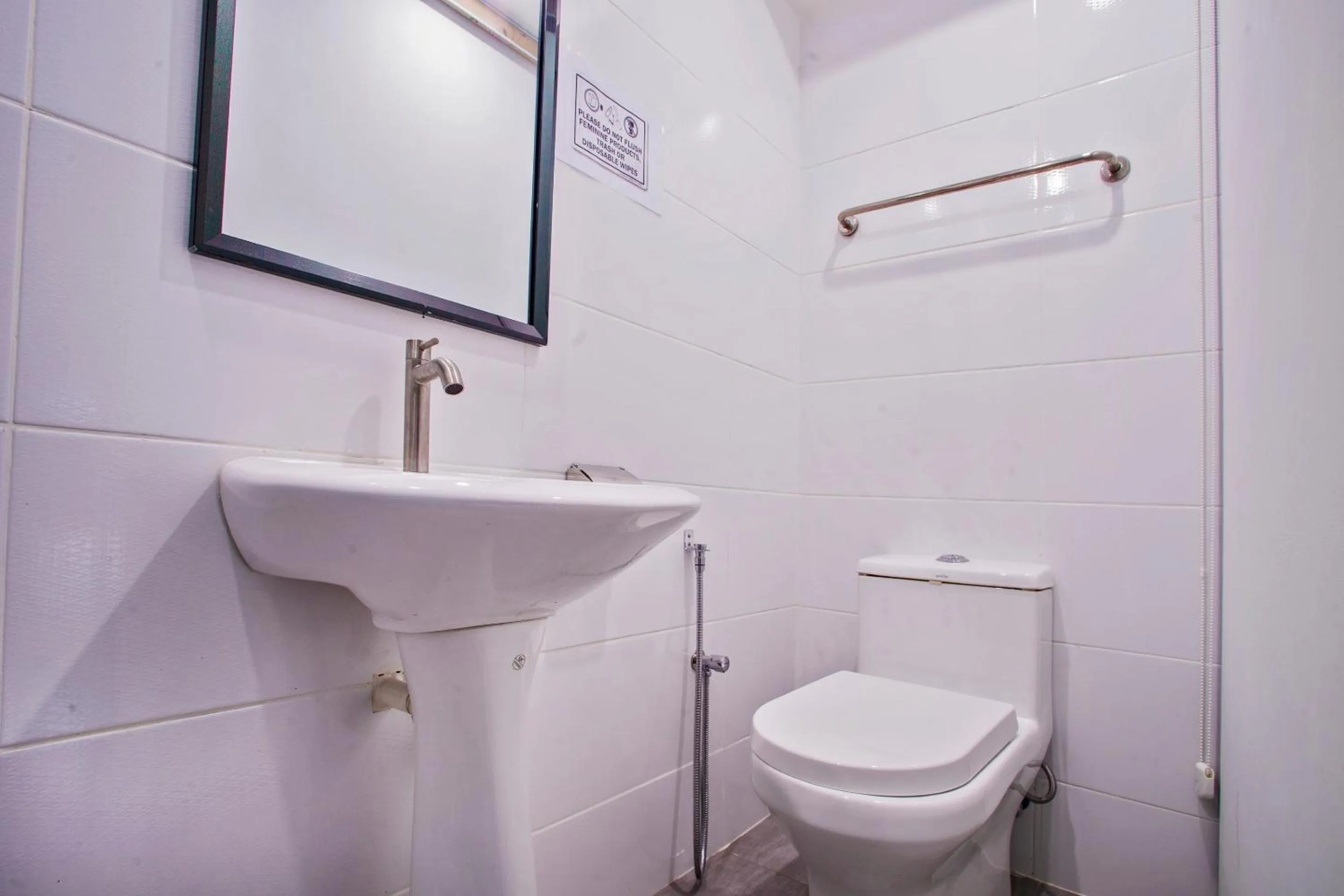 Toilet in Hotel O Gs Hotels Near Strand Mall