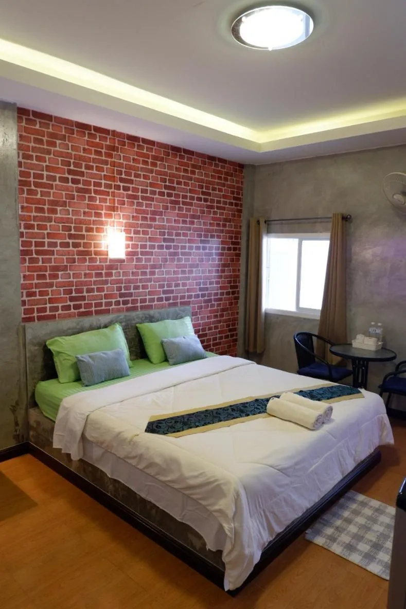 Bed in โรงแรมโทนี่วิลเลจTony Hotel