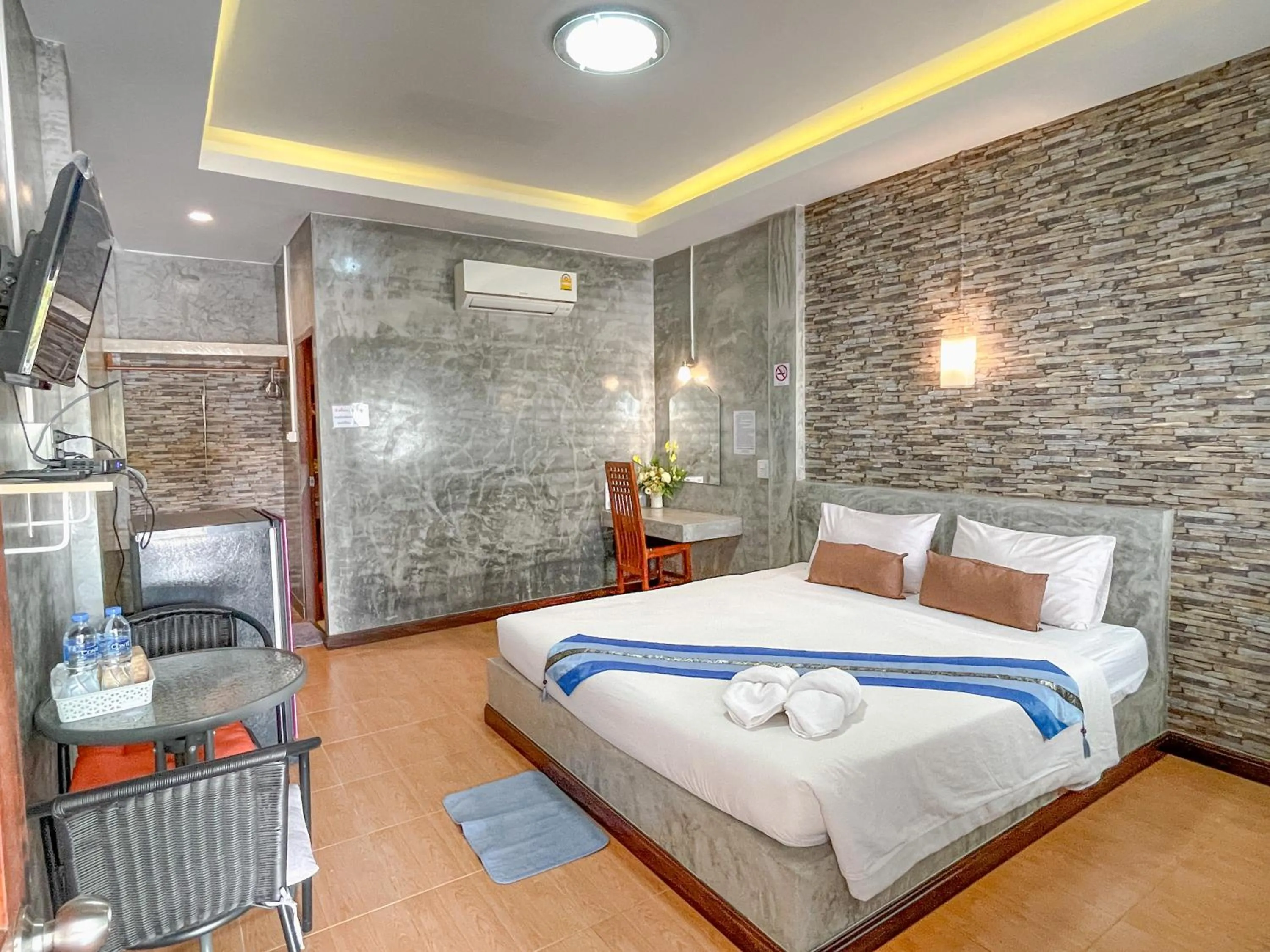 Bed in โรงแรมโทนี่วิลเลจTony Hotel