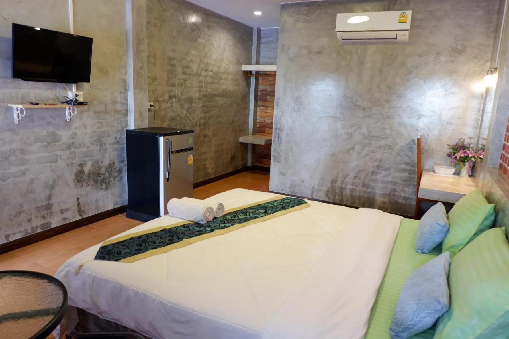 Bed in โรงแรมโทนี่วิลเลจTony Hotel