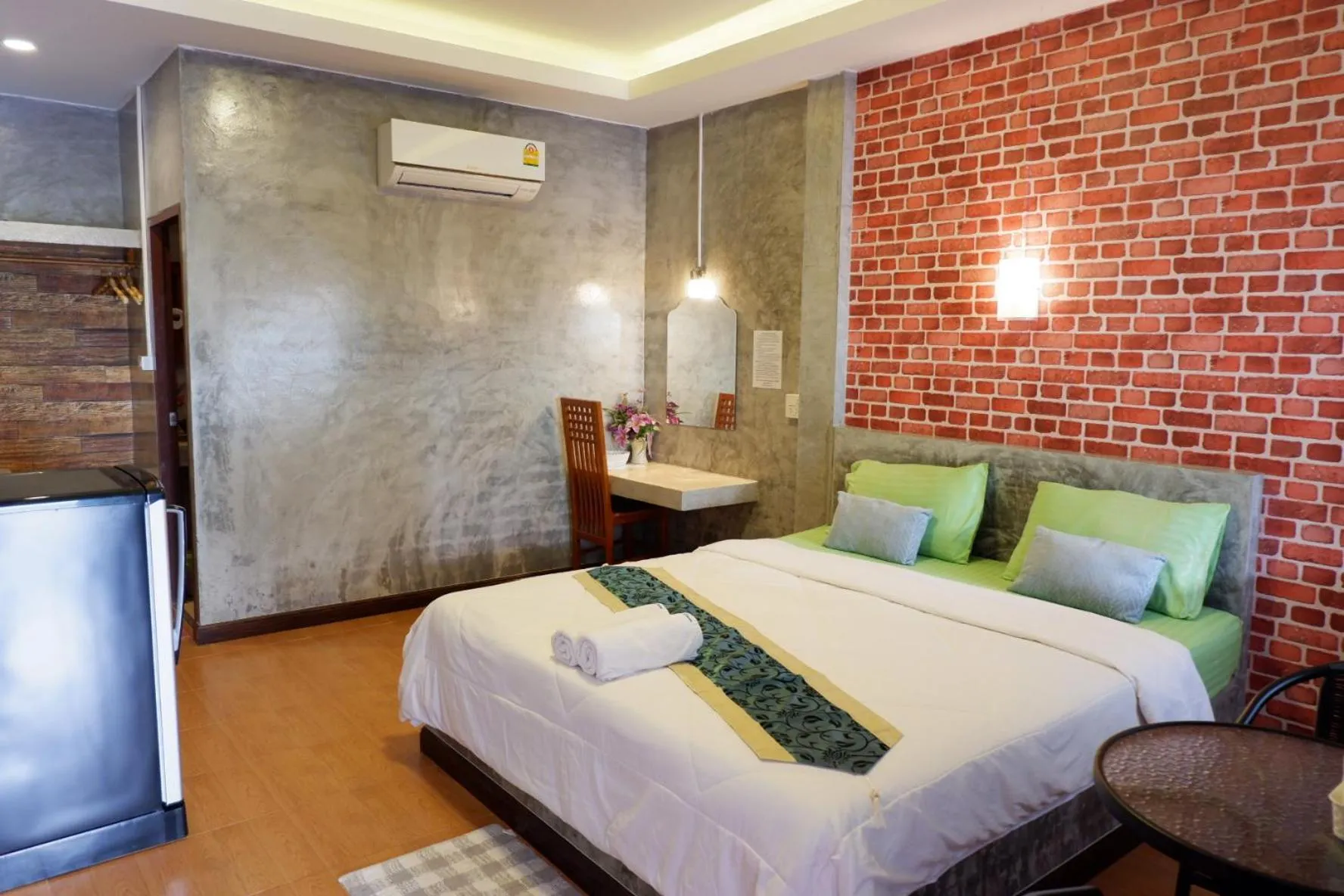 Bed in โรงแรมโทนี่วิลเลจTony Hotel