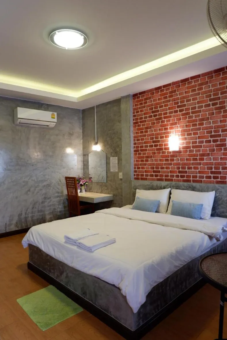 Bed in โรงแรมโทนี่วิลเลจTony Hotel