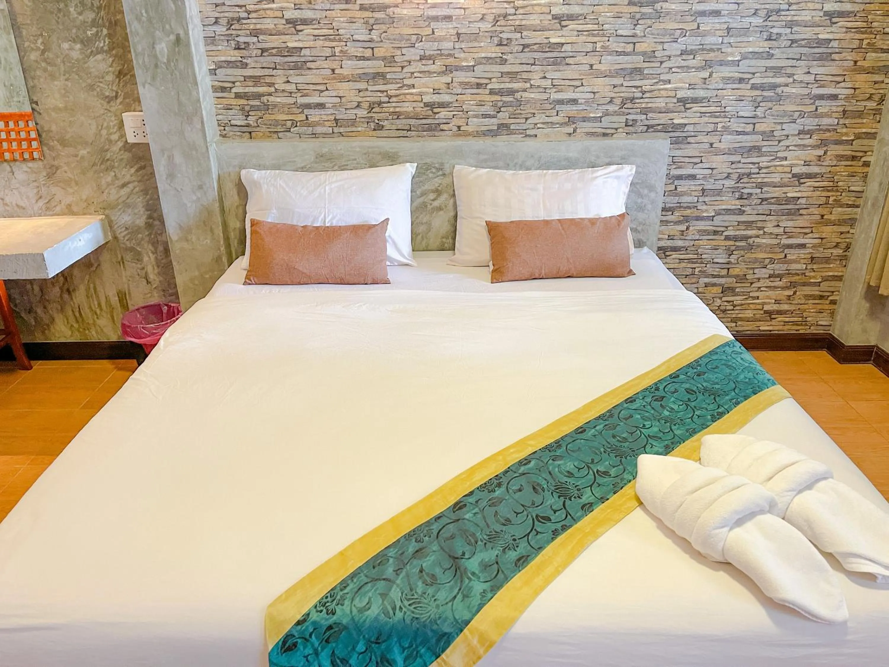 Bed in โรงแรมโทนี่วิลเลจTony Hotel