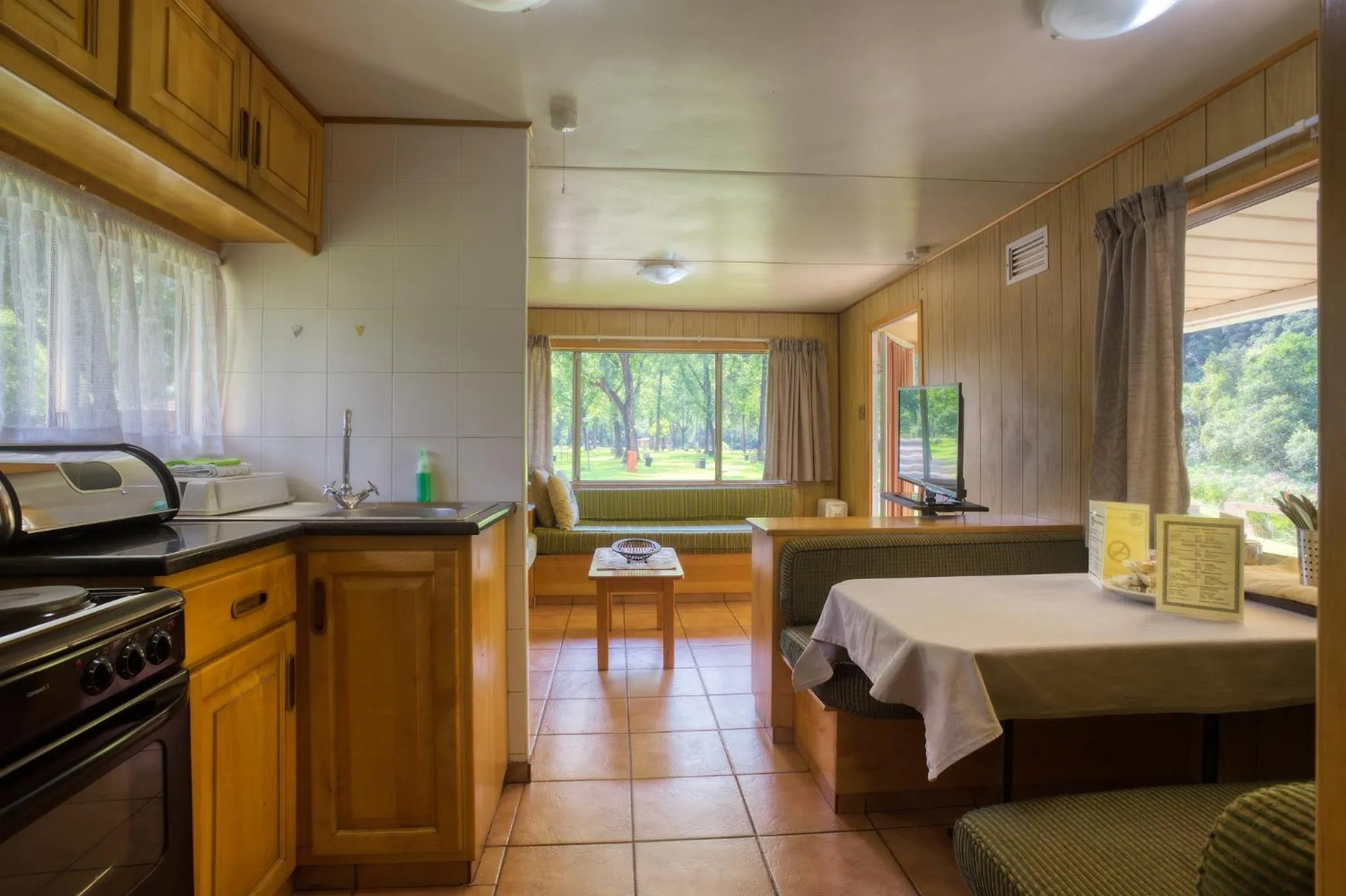 Kitchen or kitchenette, Bed in Merry Pebbles Resort