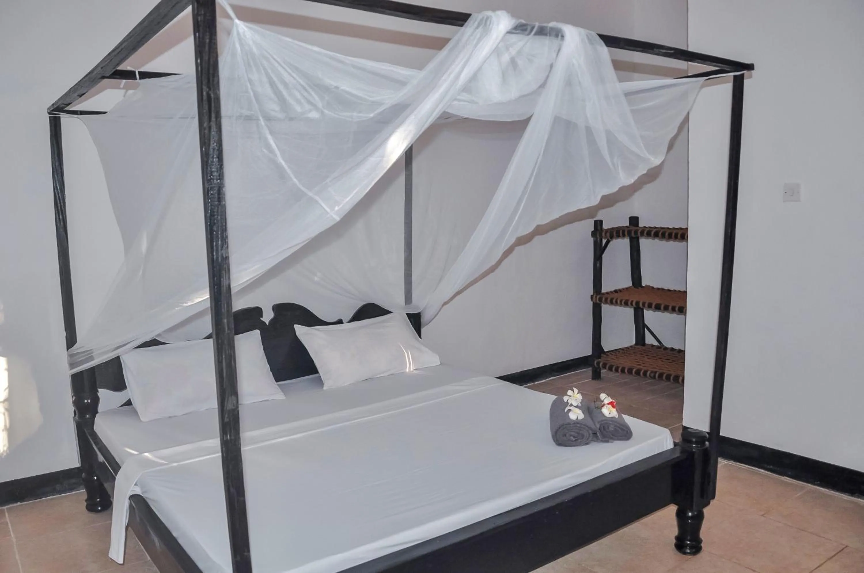 Bed in Papaya Guest House Nungwi