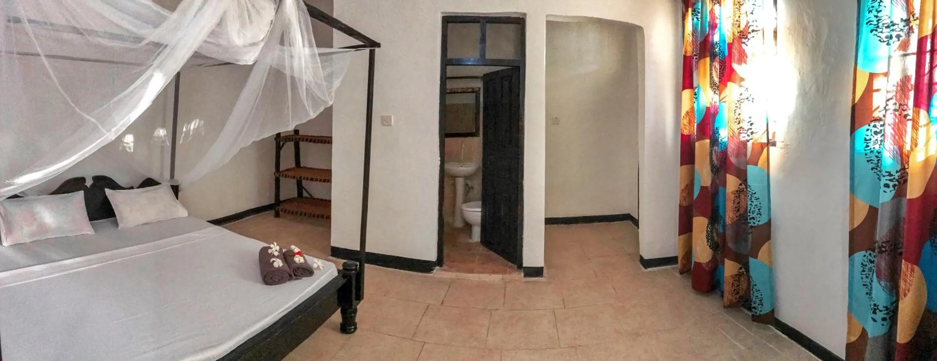 Bathroom, Bed in Papaya Guest House Nungwi