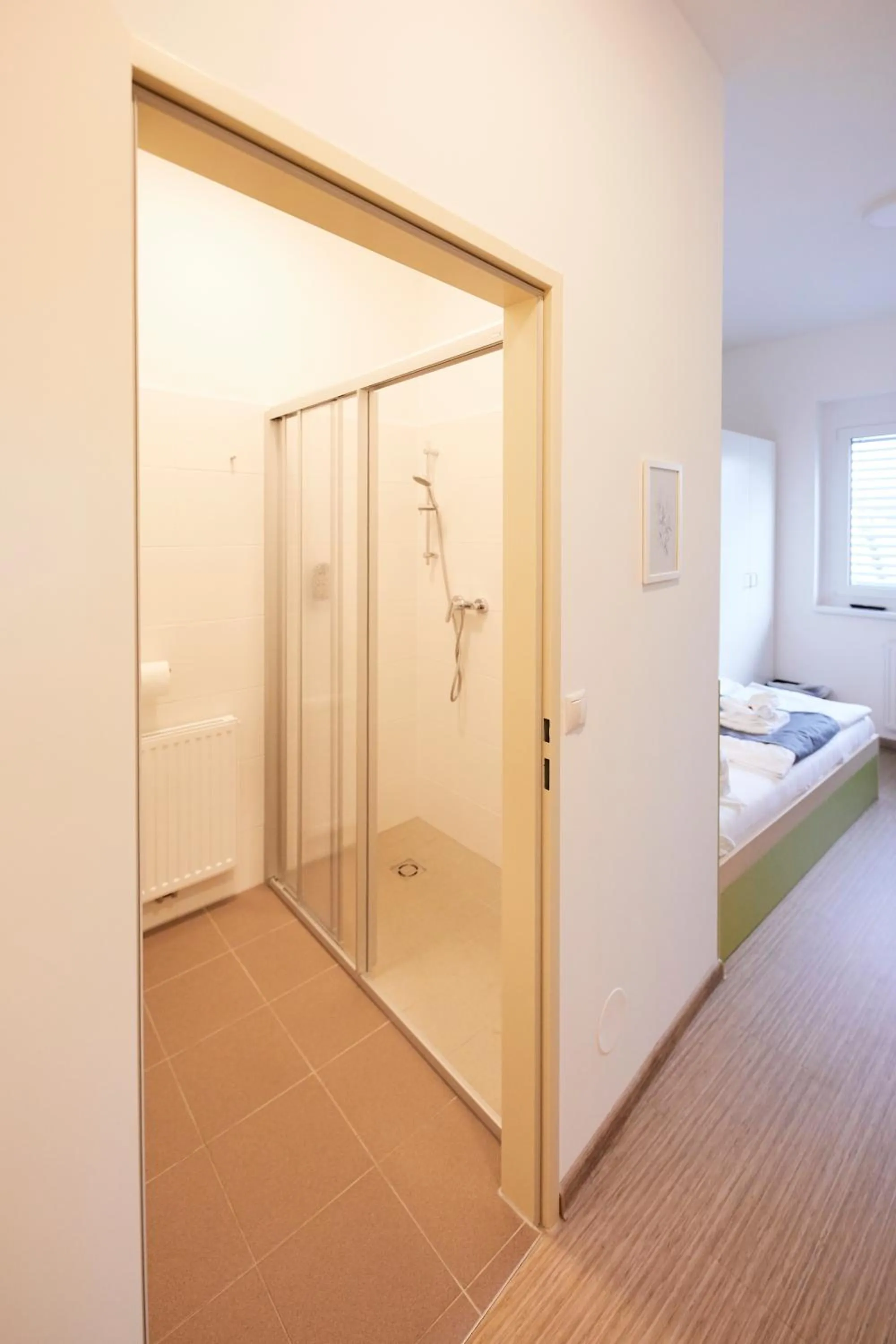 Bathroom, Bed in I AM HOTEL Leoben