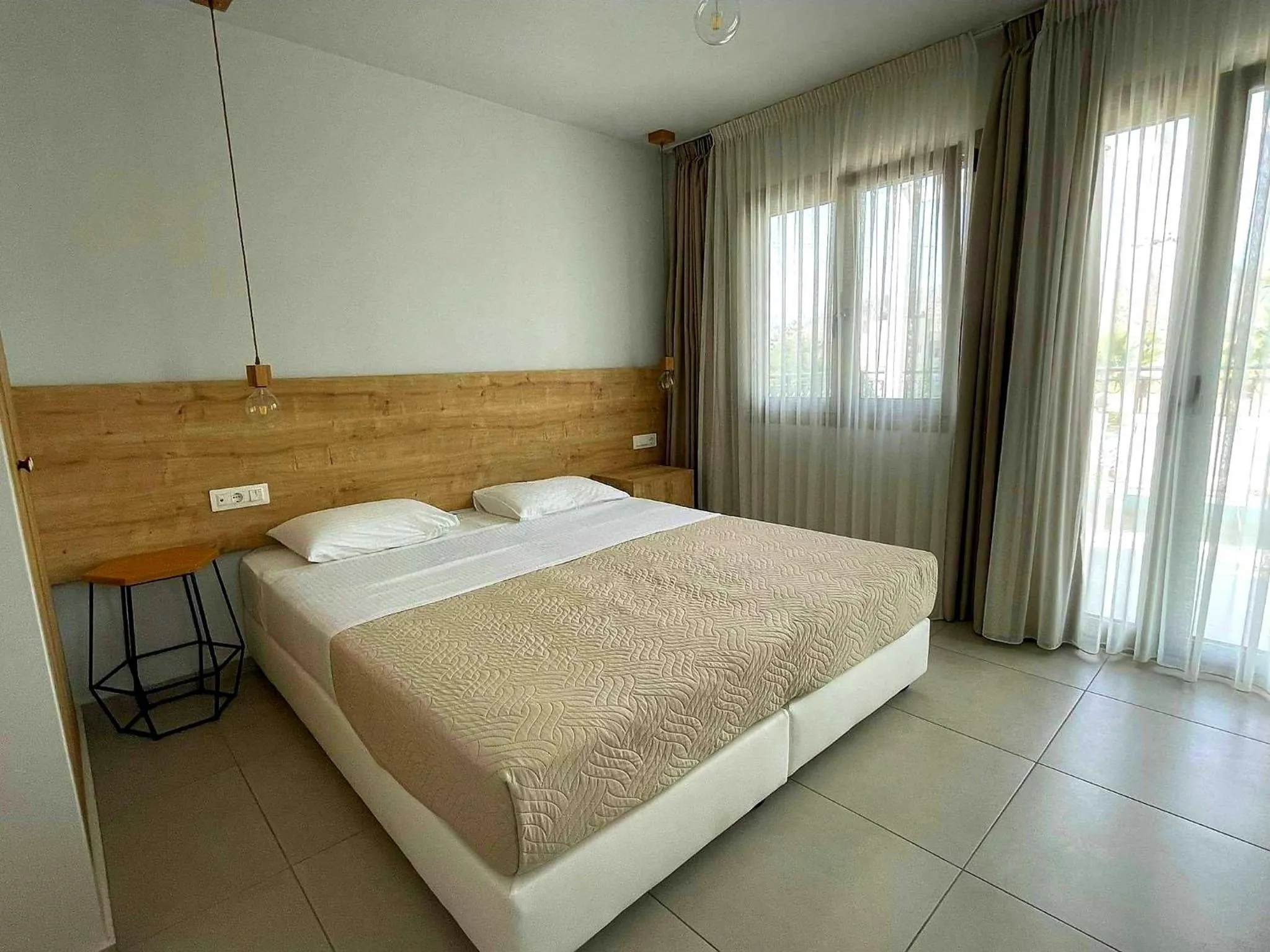 Bed in Minoa Apartments