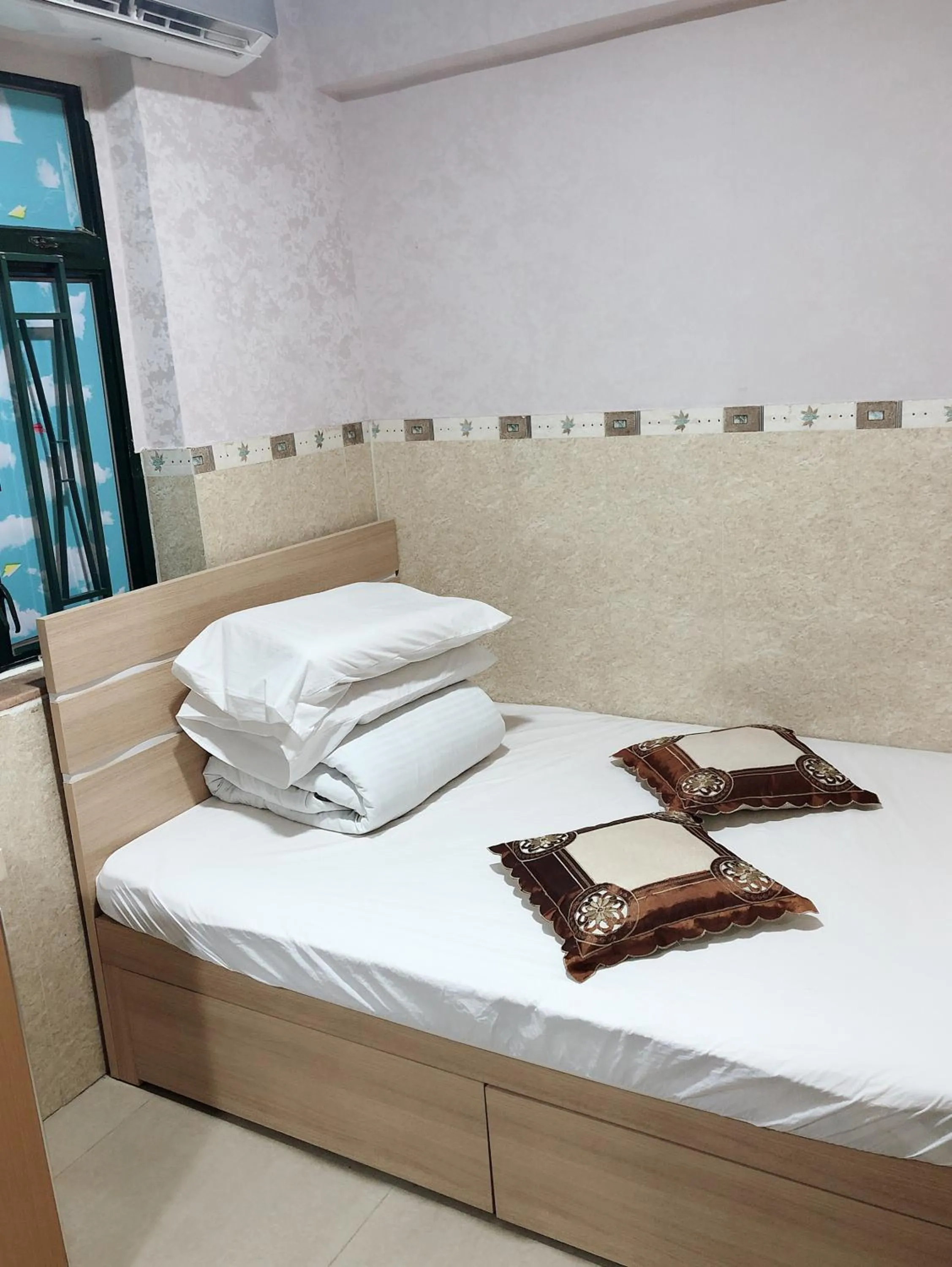 Bed in Hung Fai Guest House