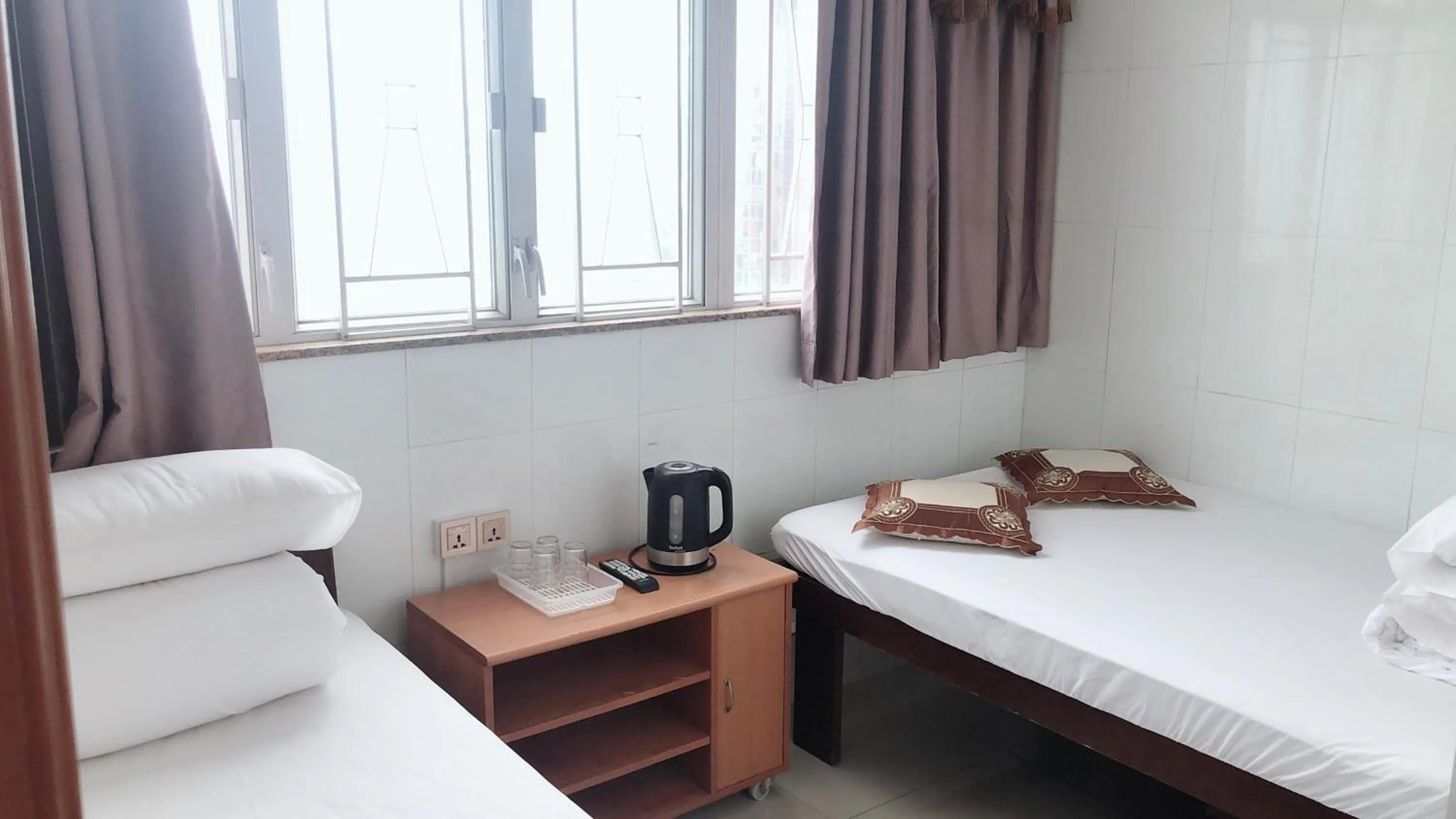 Bed in Hung Fai Guest House