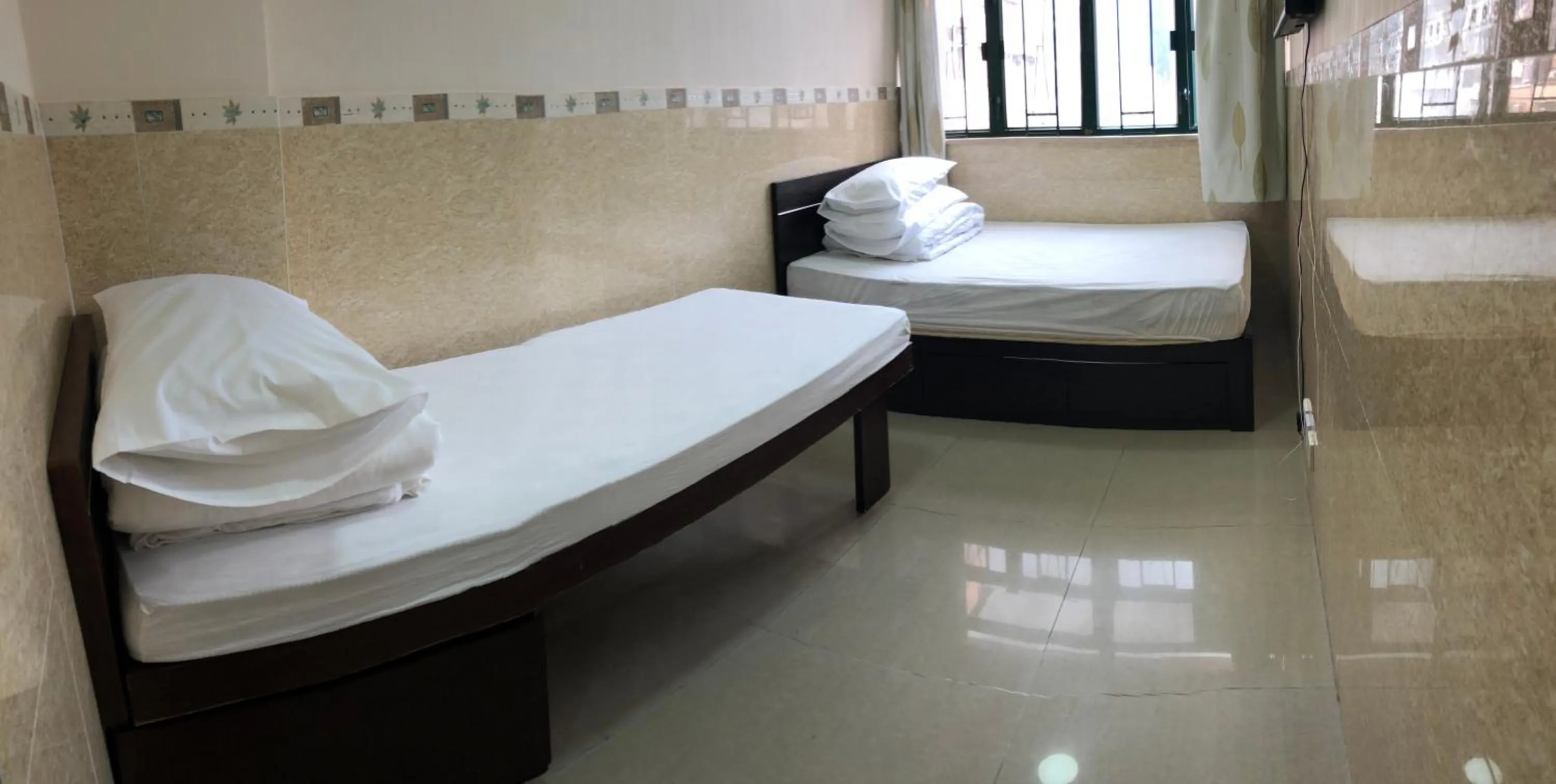 Bed in Hung Fai Guest House