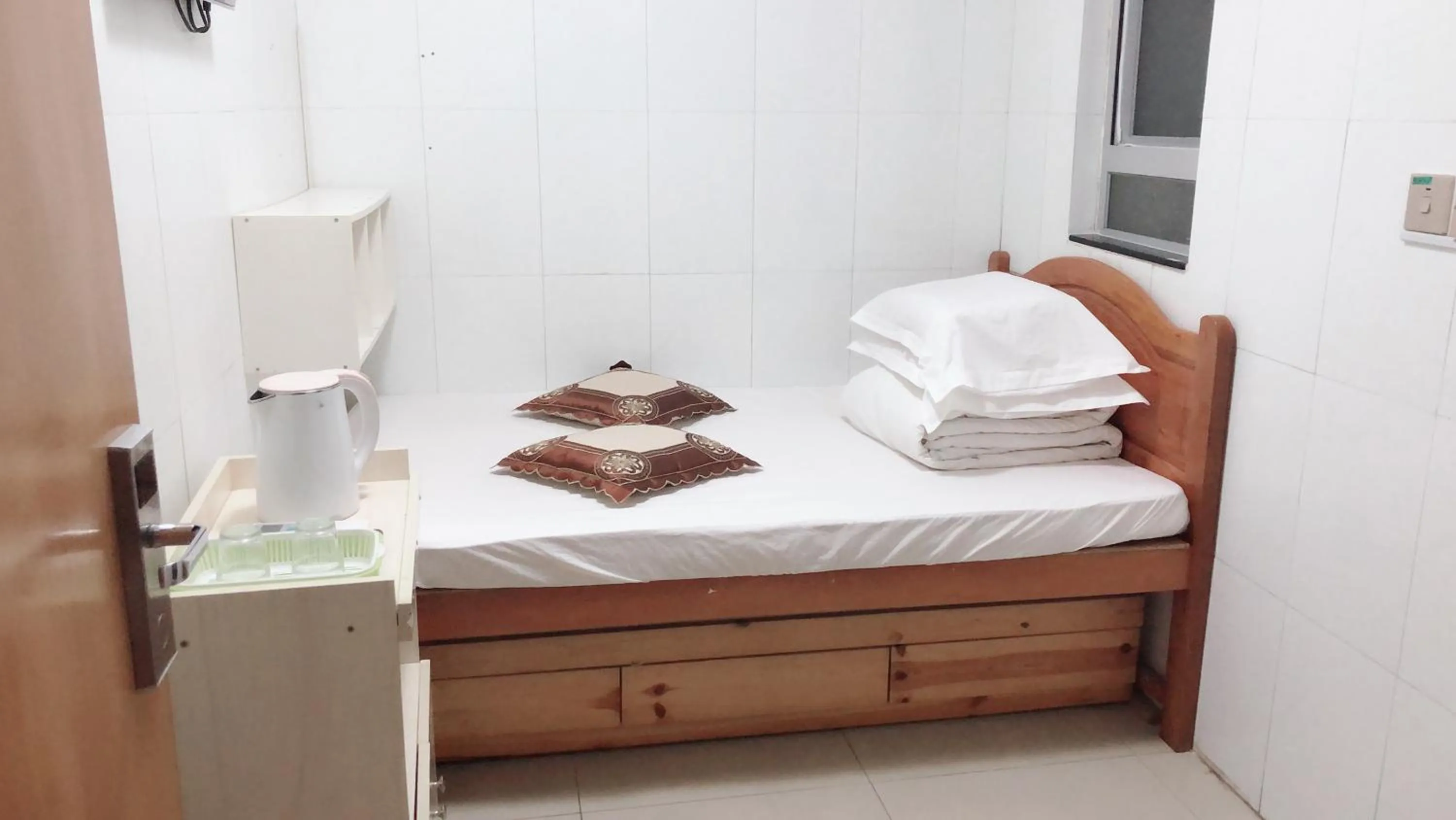 Bed in Hung Fai Guest House