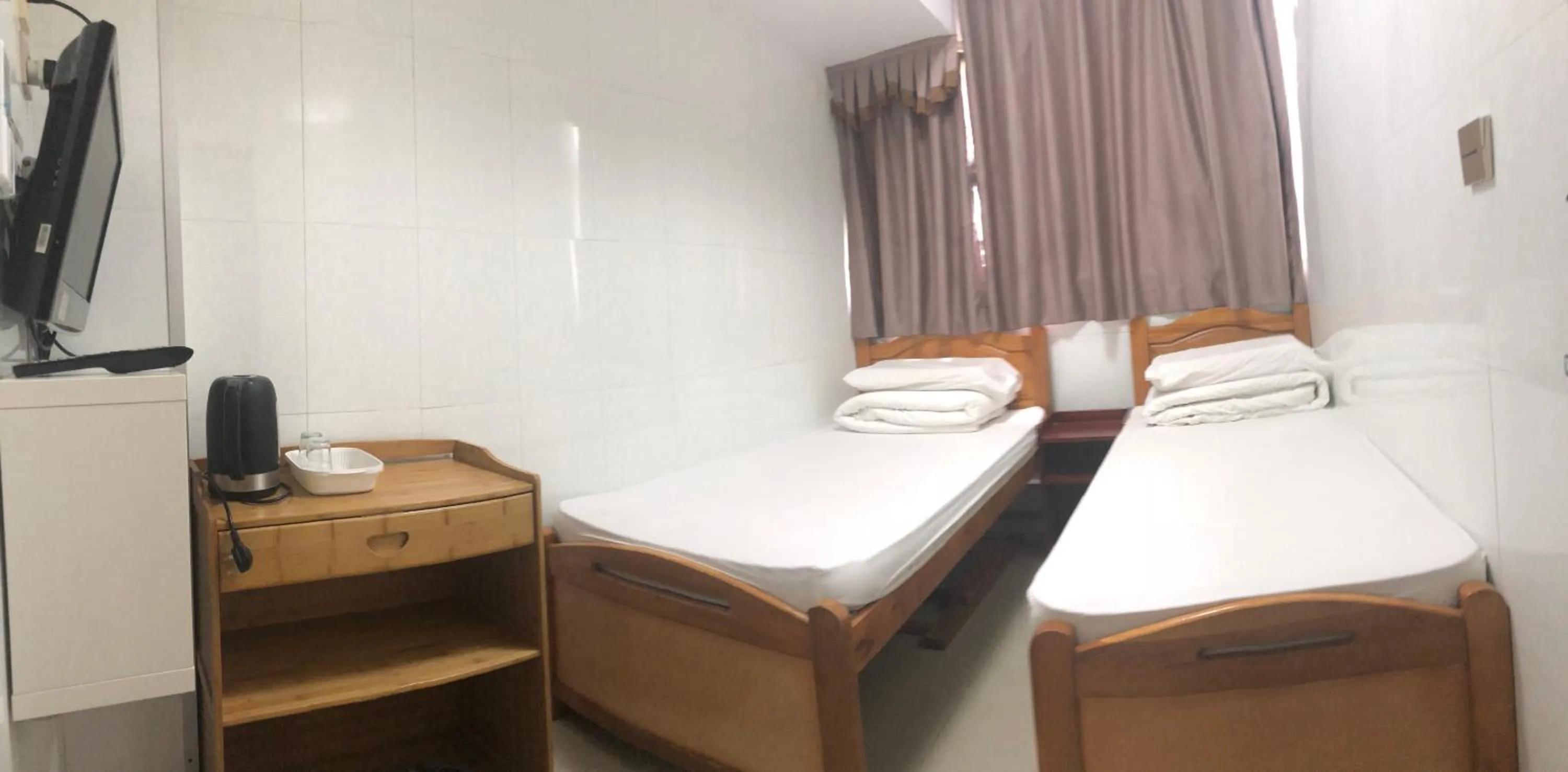 Bed in Hung Fai Guest House