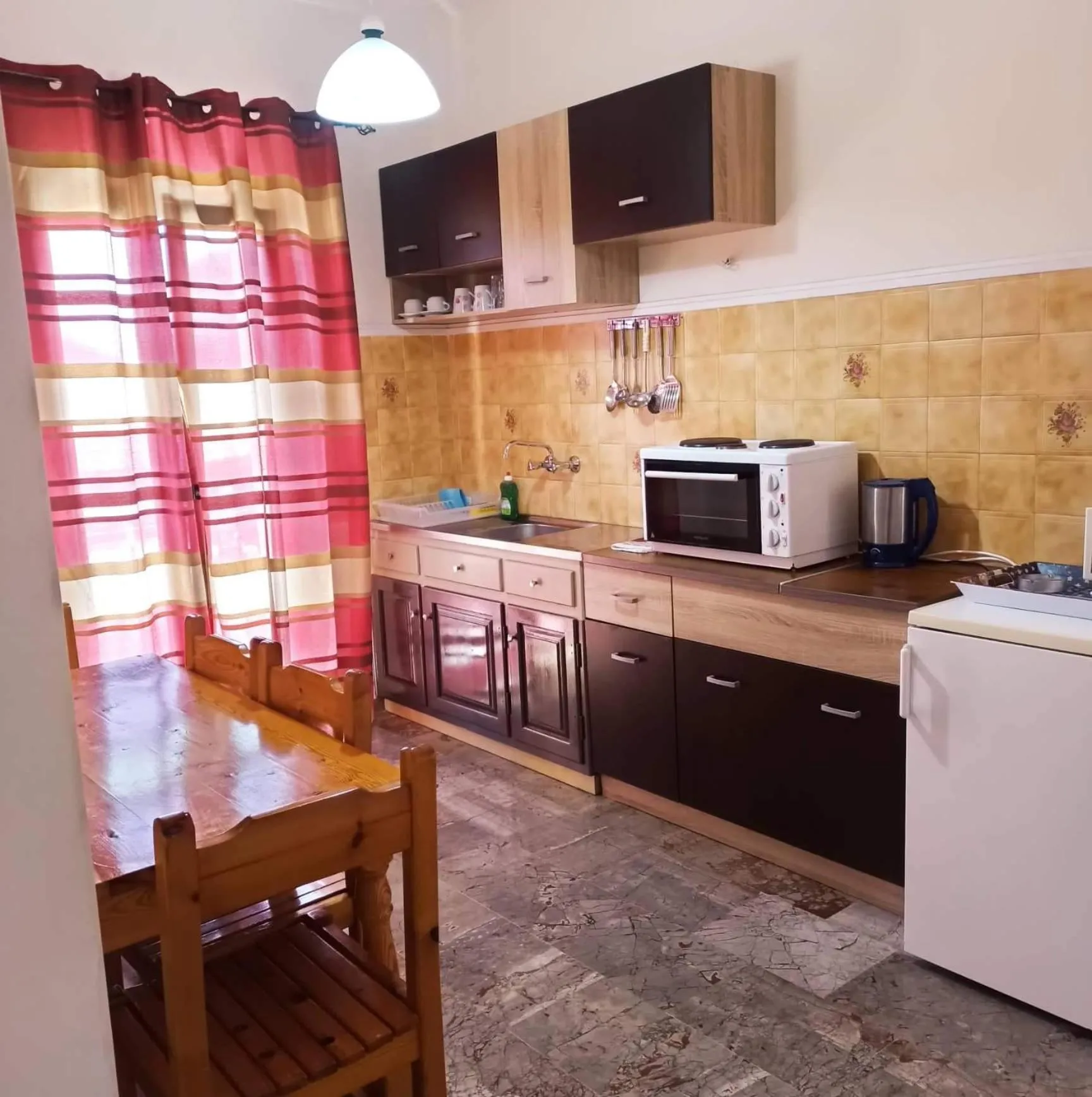 Kitchen or kitchenette in Corfu Sunflower Apartments