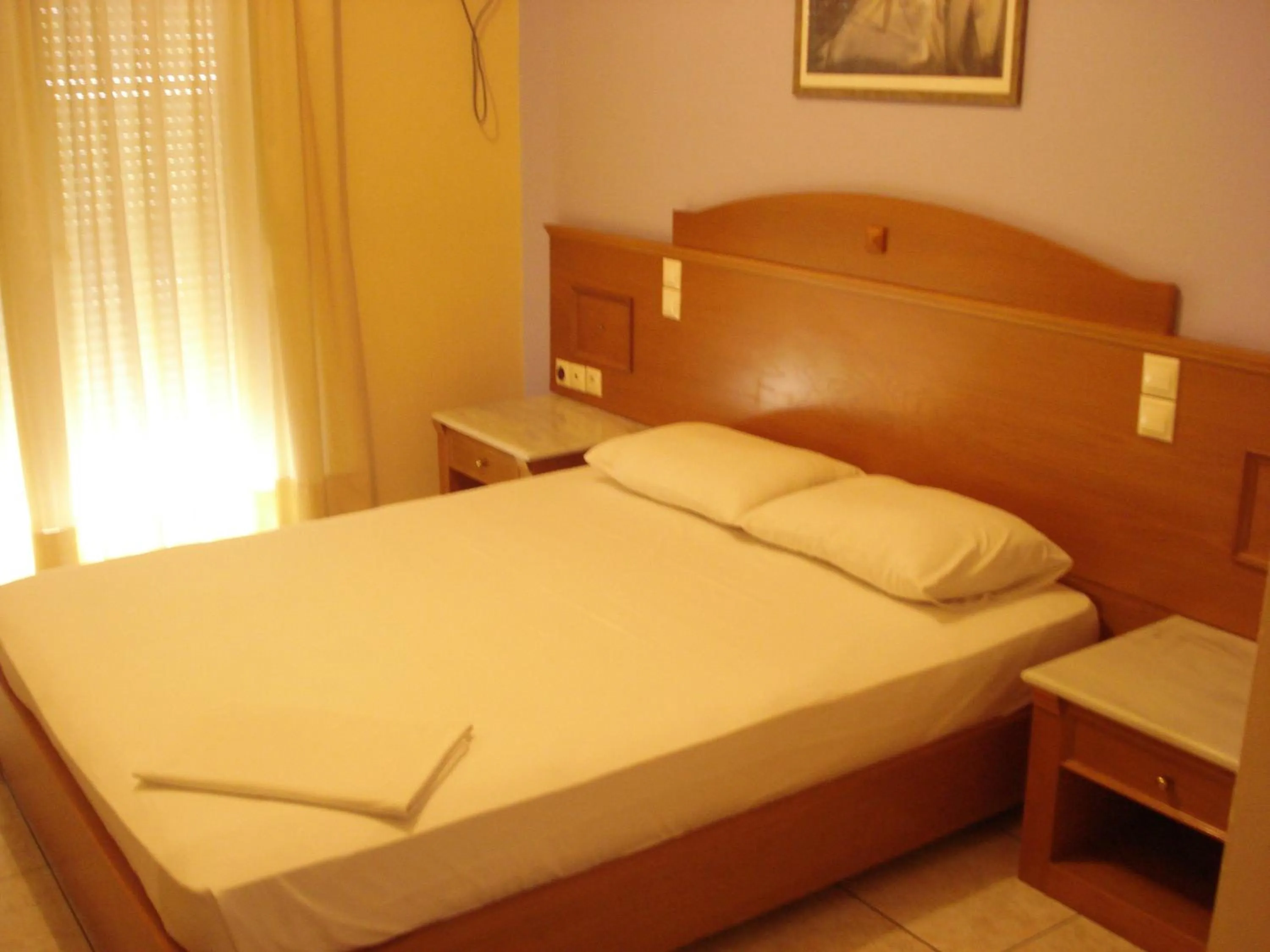 Bed in Hotel Cybele Pefki