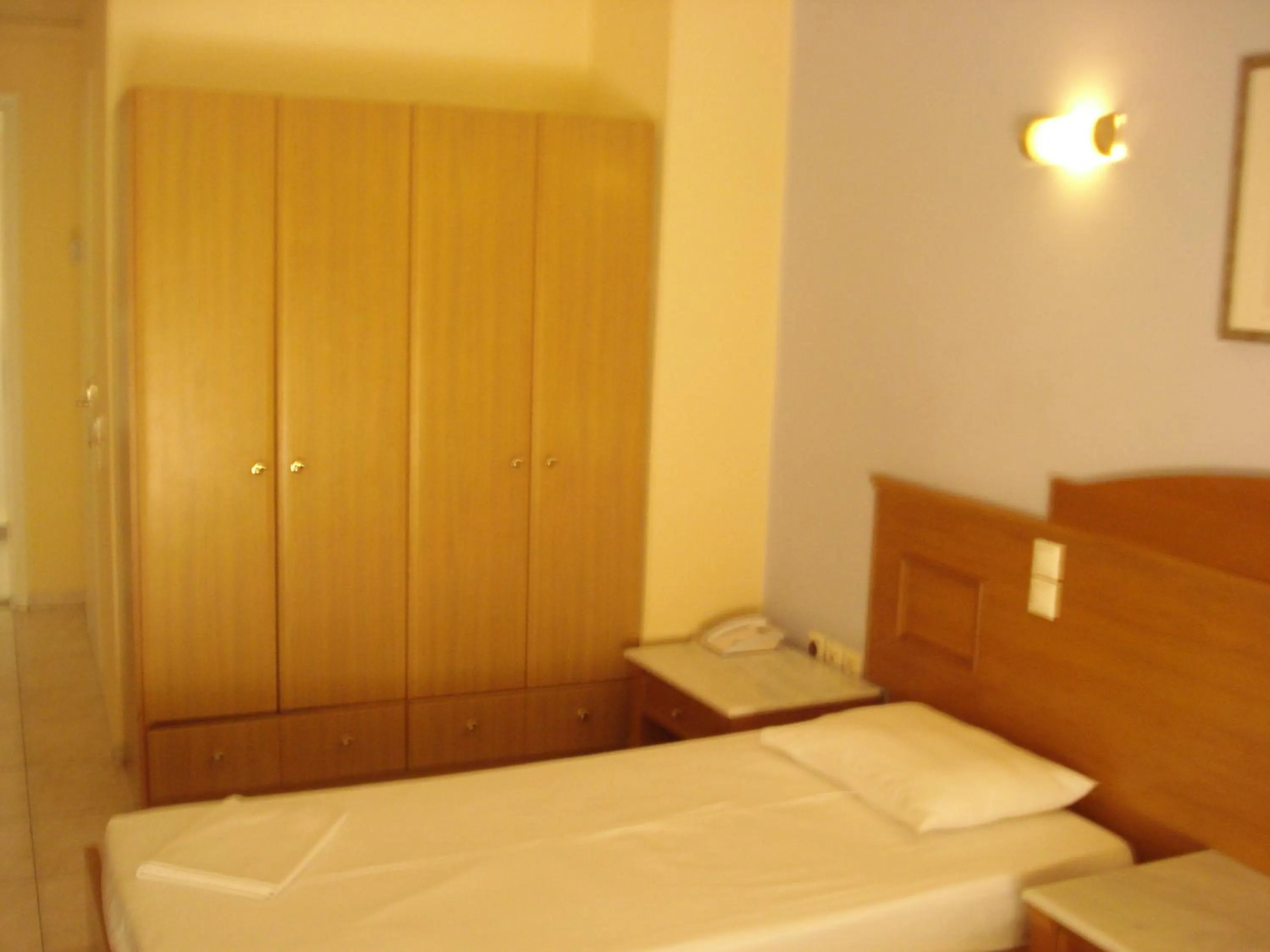 Bed in Hotel Cybele Pefki