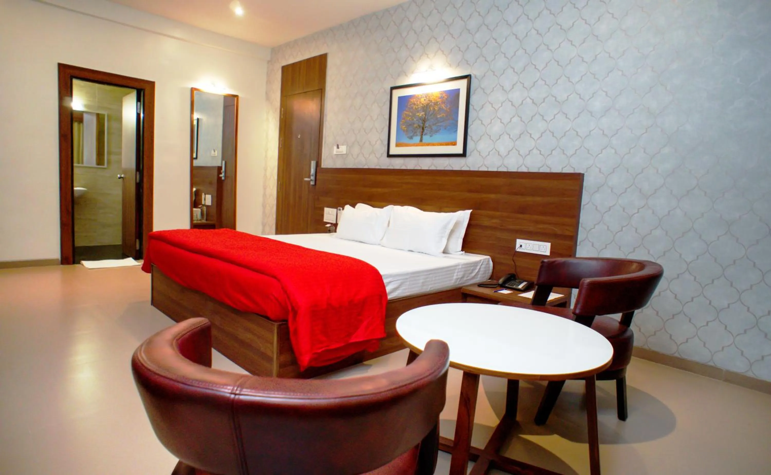 Seating area, Bed in Mastiff Hotel Chinchwad by OTHPL