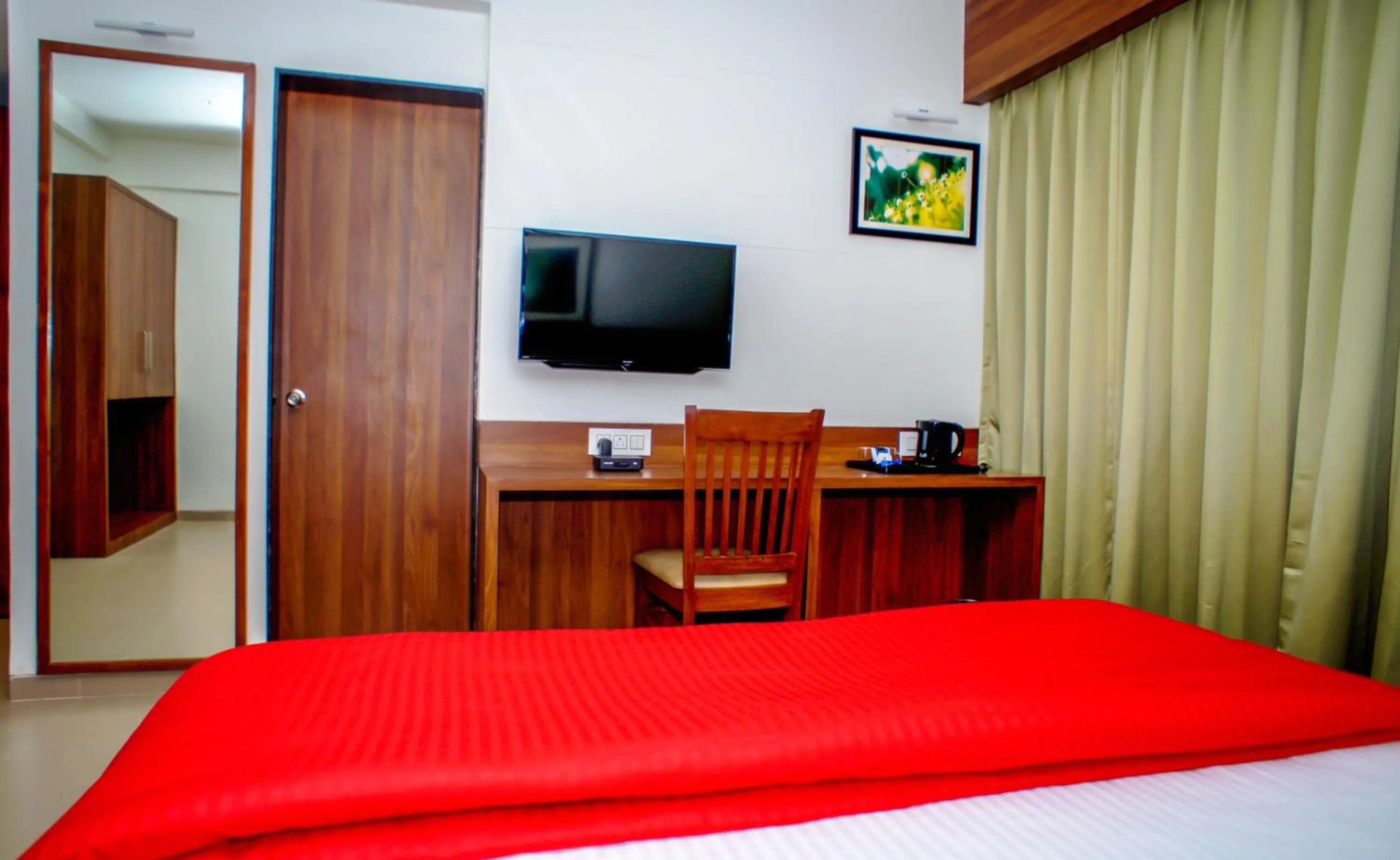 Seating area, Bed in Mastiff Hotel Chinchwad by OTHPL
