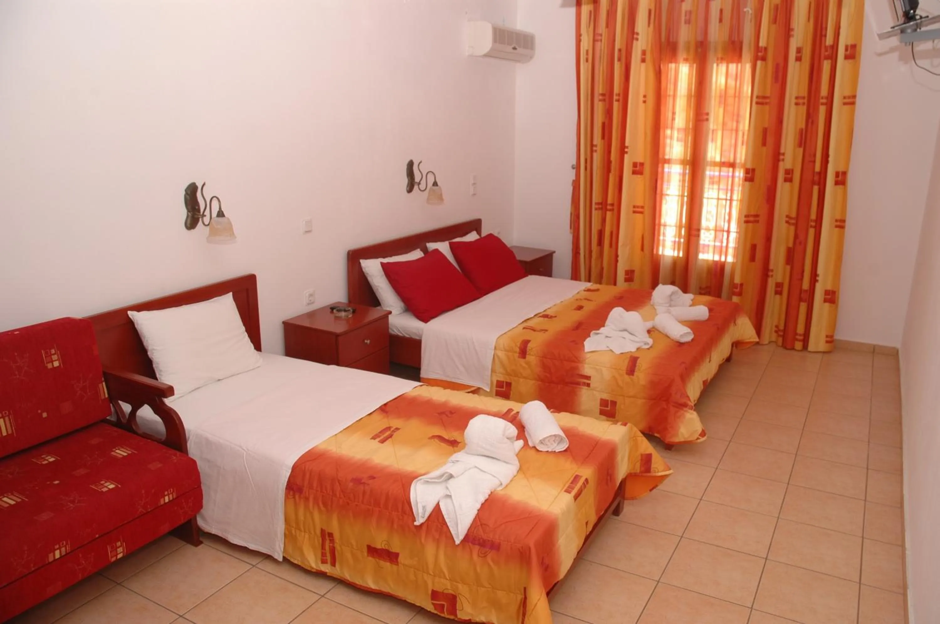 Bed in Agnanti Hotel