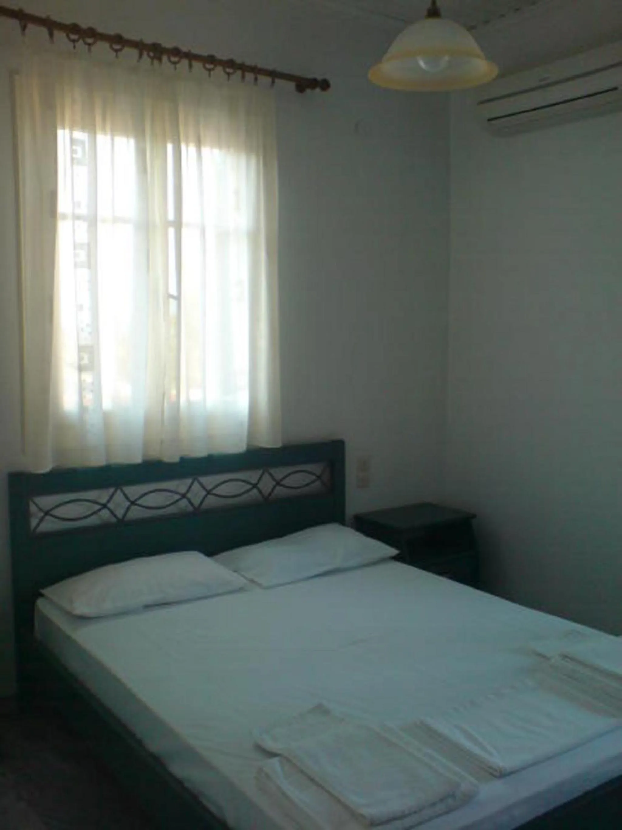 Bed in Odysseia Apartments