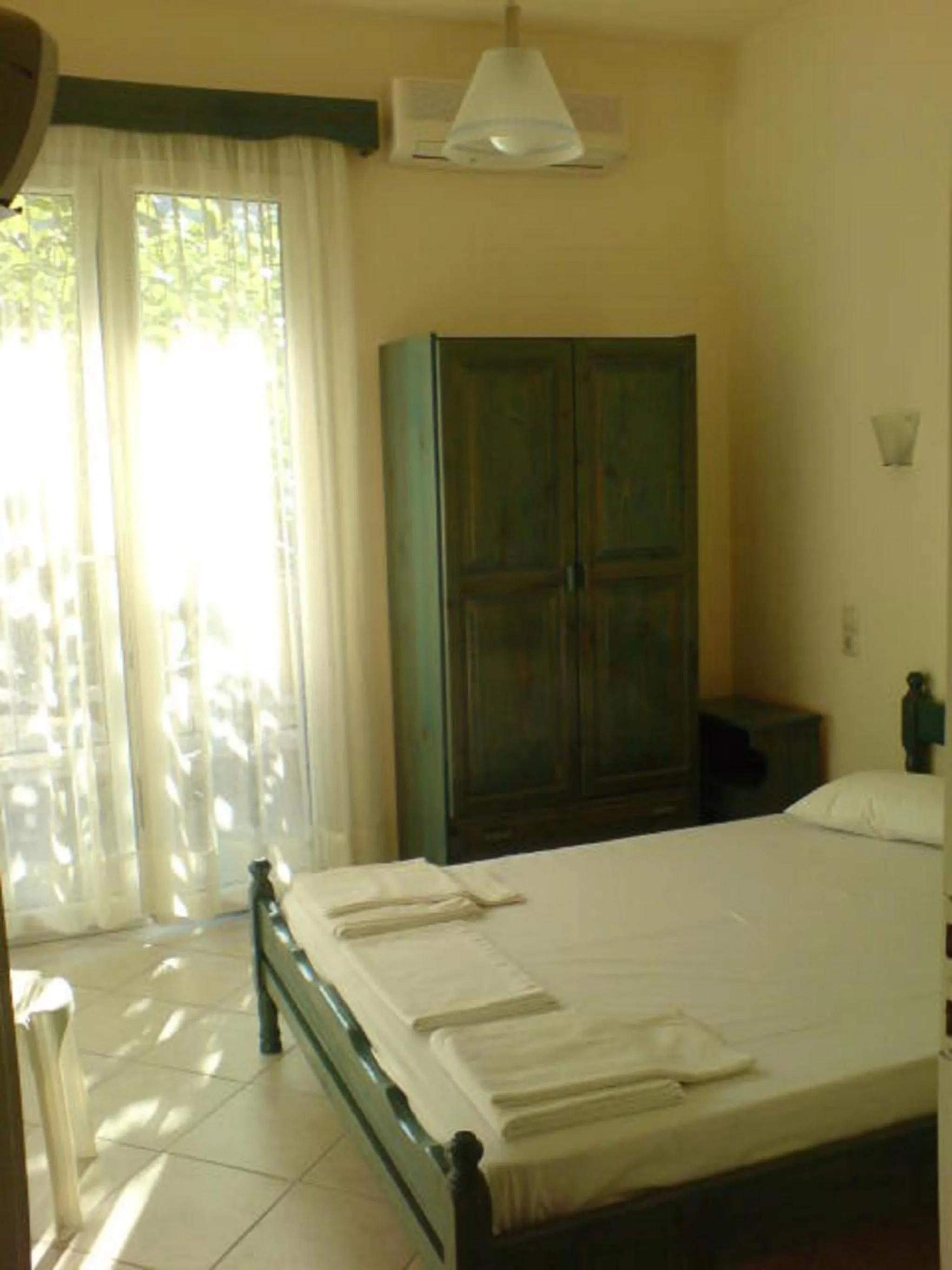 Bed in Odysseia Apartments