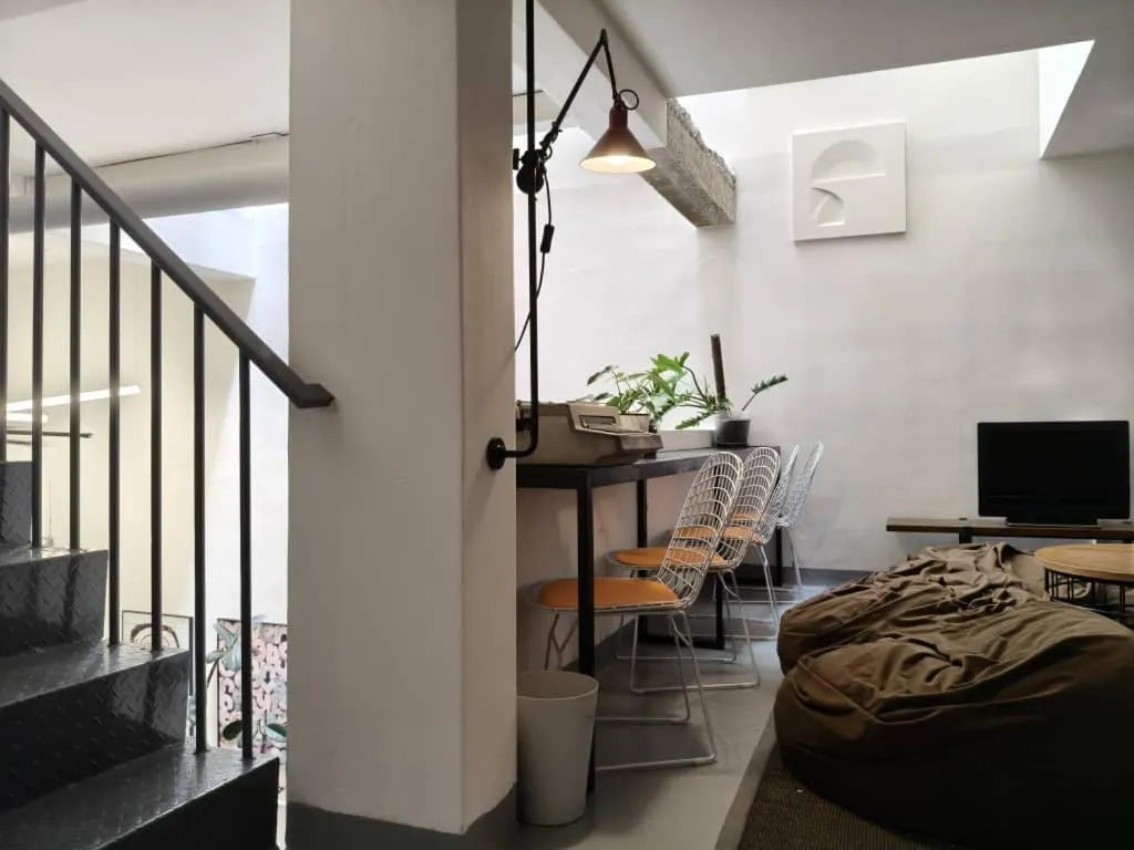 Seating area, Bed in The Brownstone Hostel & Space