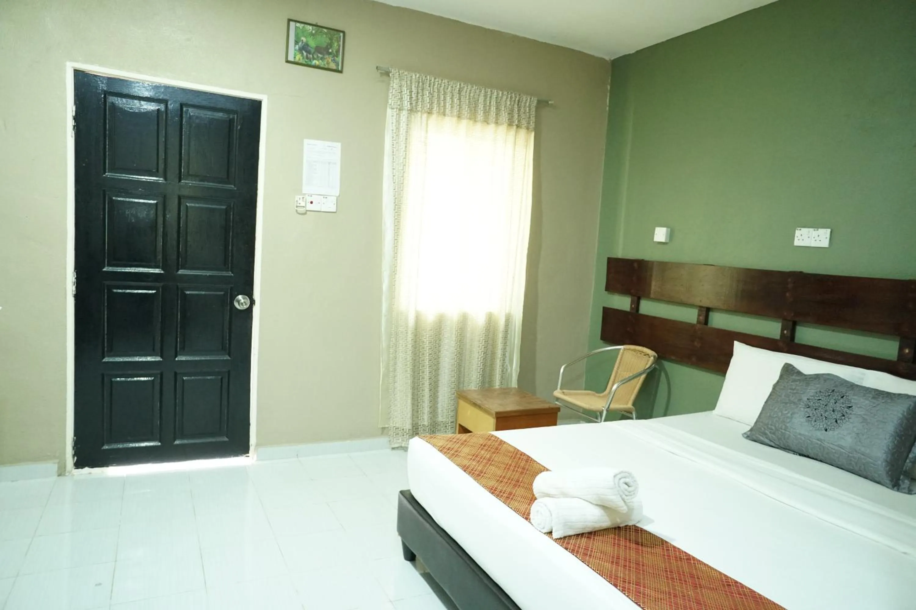 Bed in Pondok Muara Chalet