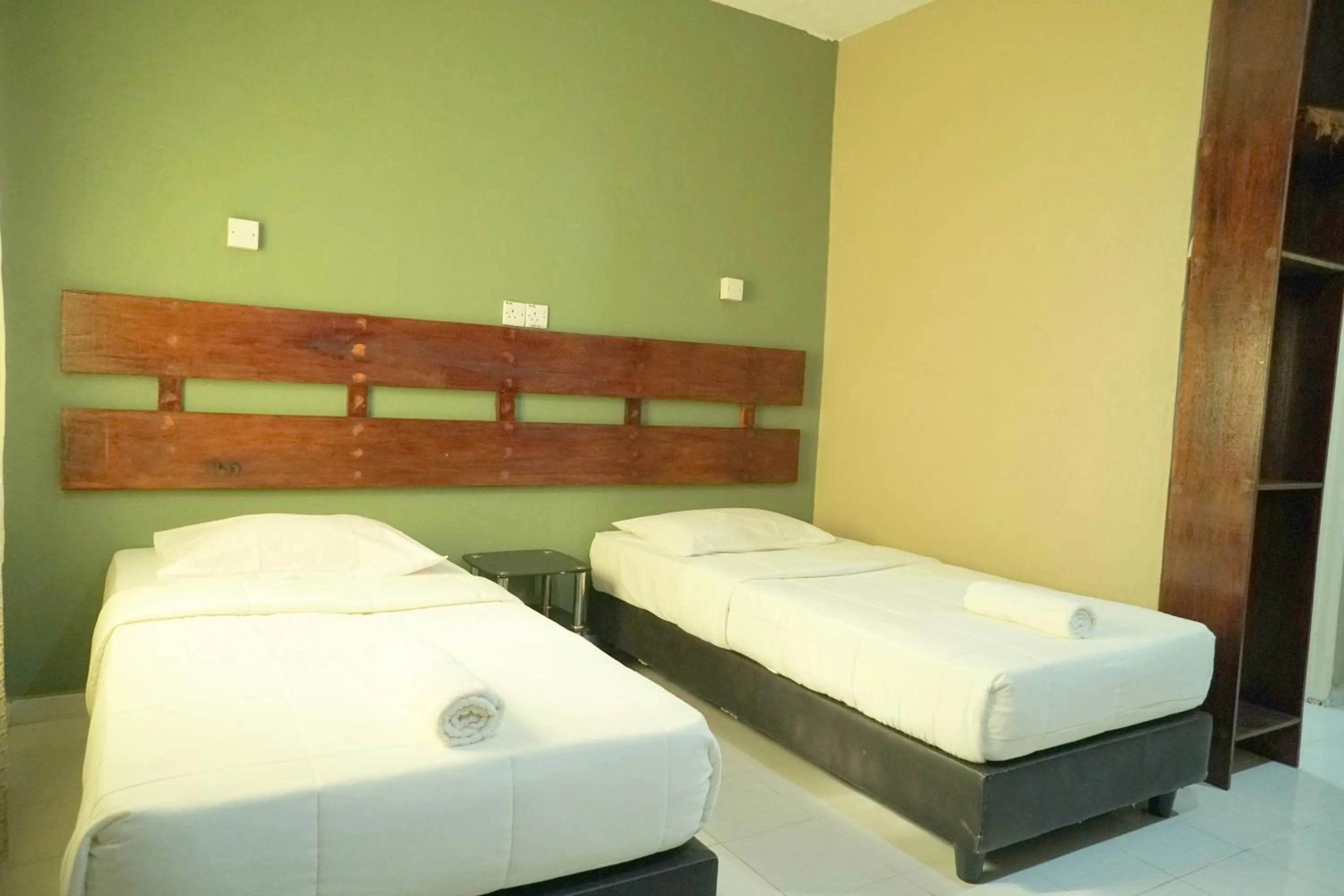 Bed in Pondok Muara Chalet