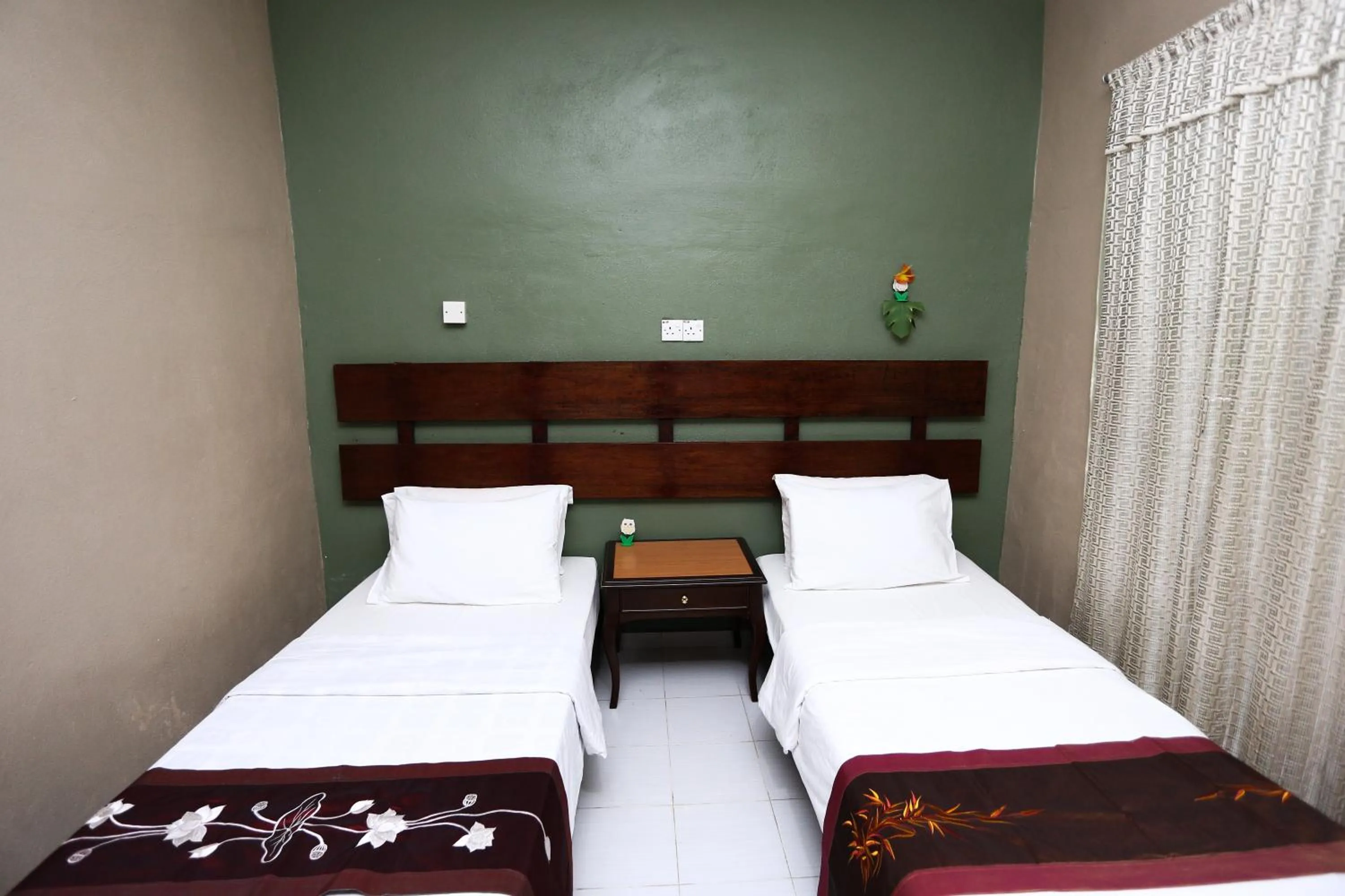 Bed in Pondok Muara Chalet