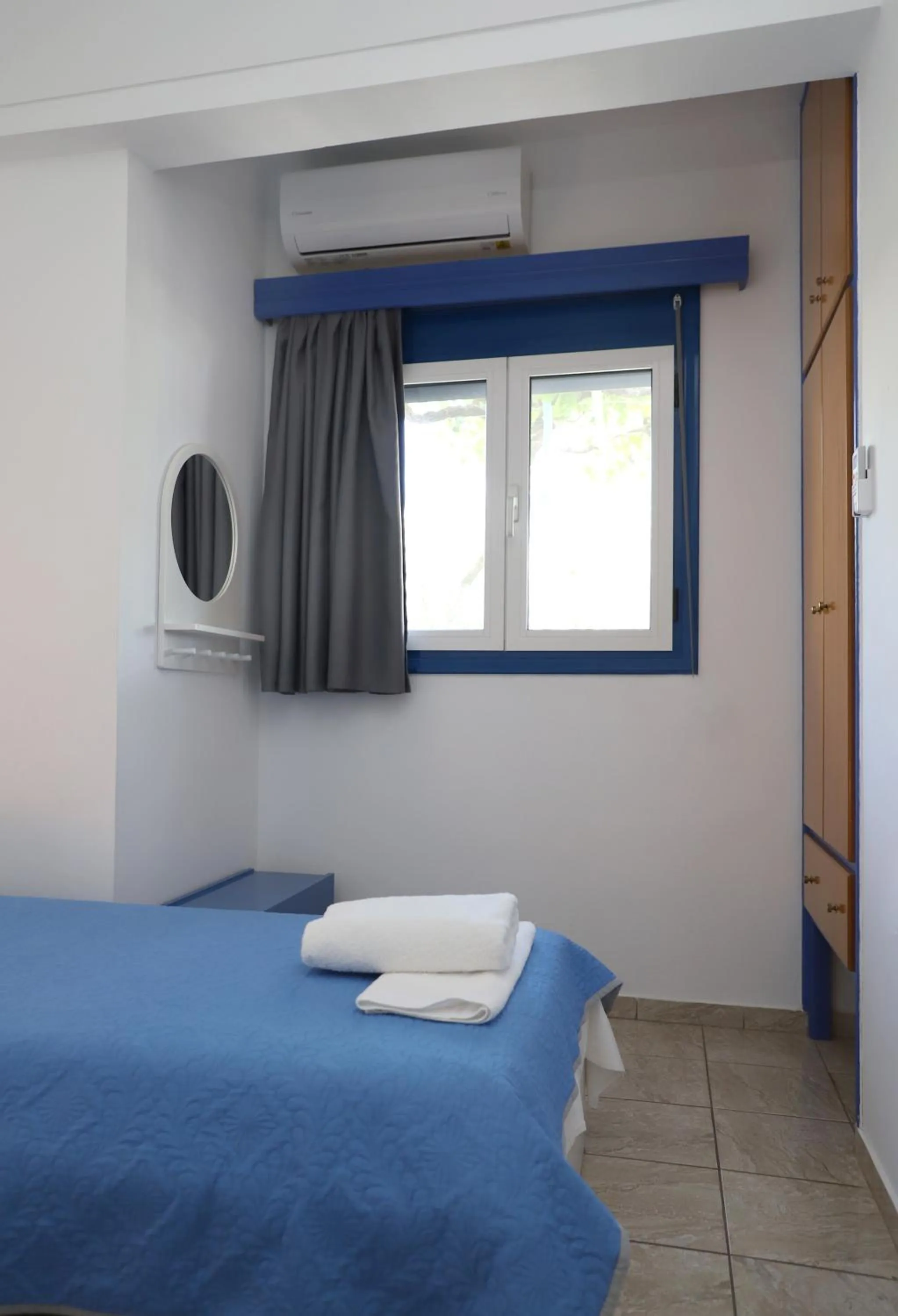 Bed in Helios Studios & Apartments