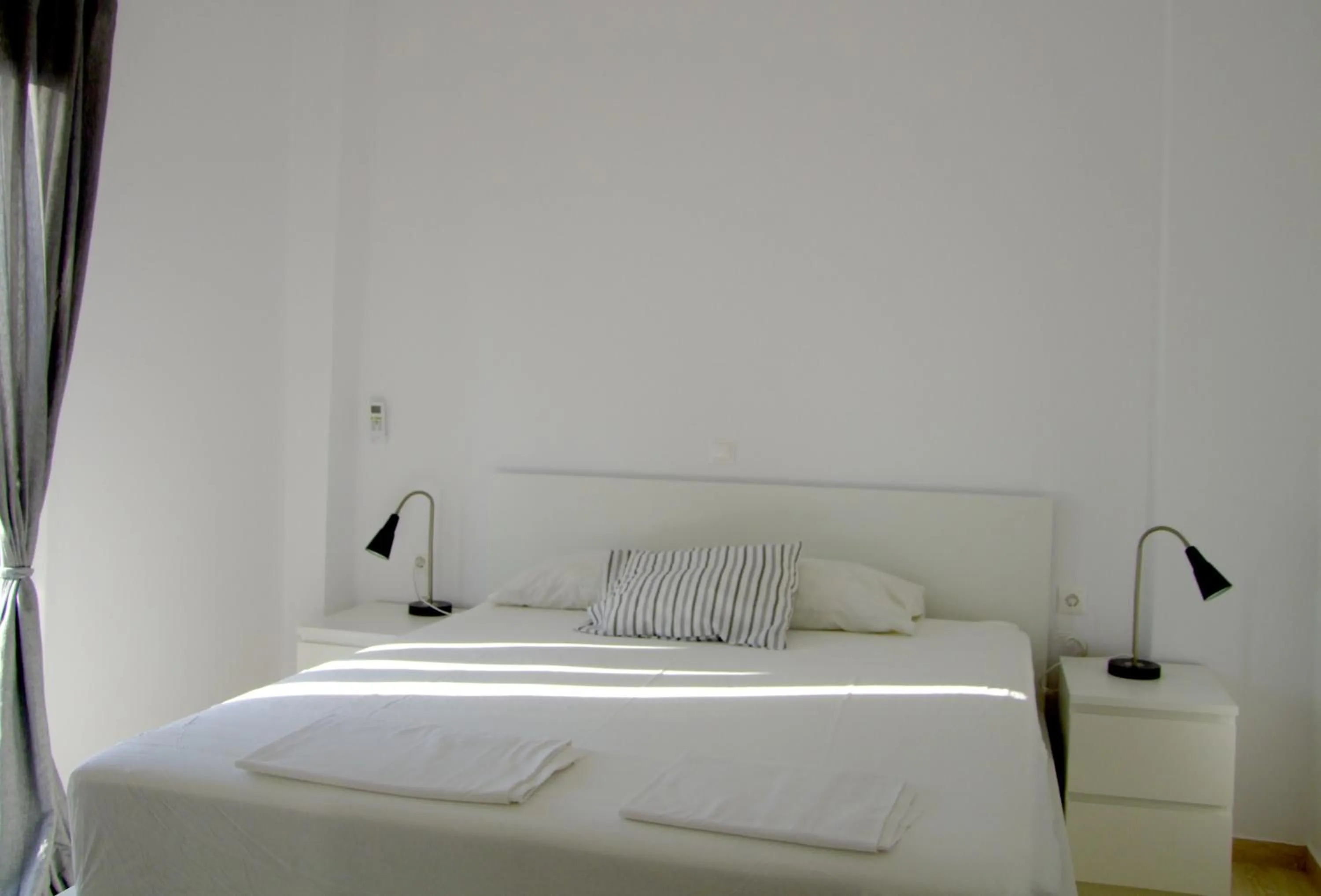 Bed in Helios Studios & Apartments
