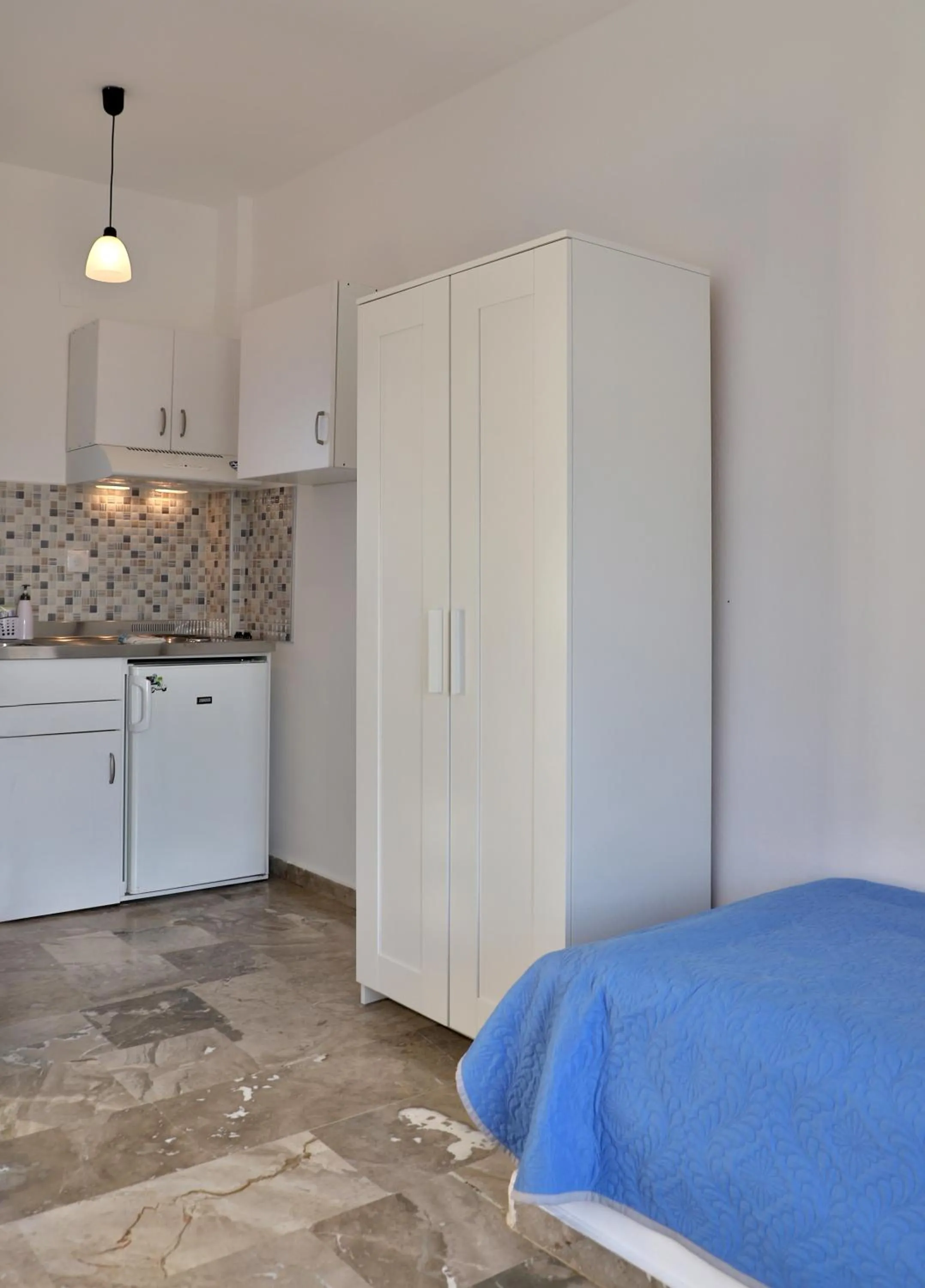 Bed in Helios Studios & Apartments