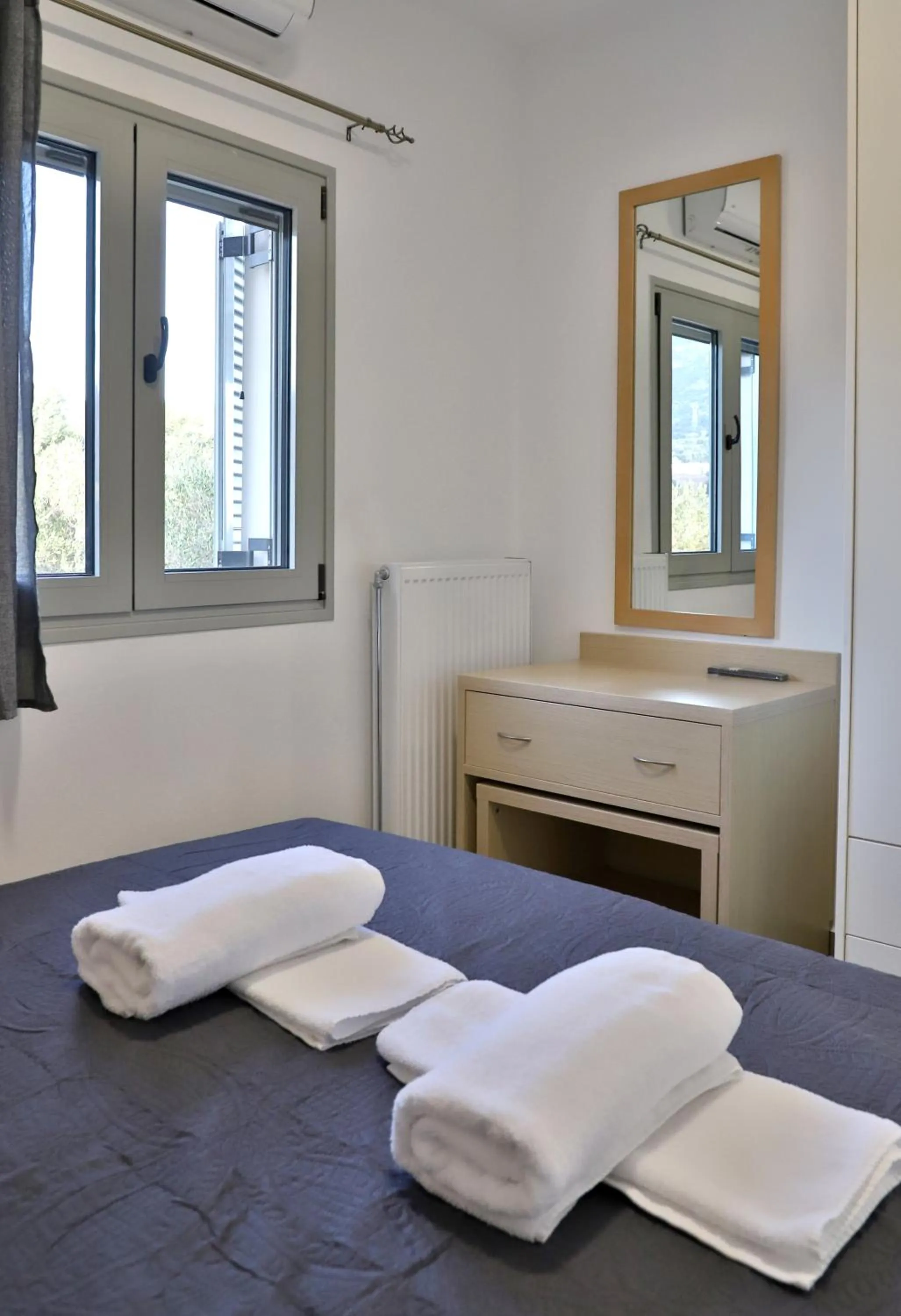 Bed in Helios Studios & Apartments