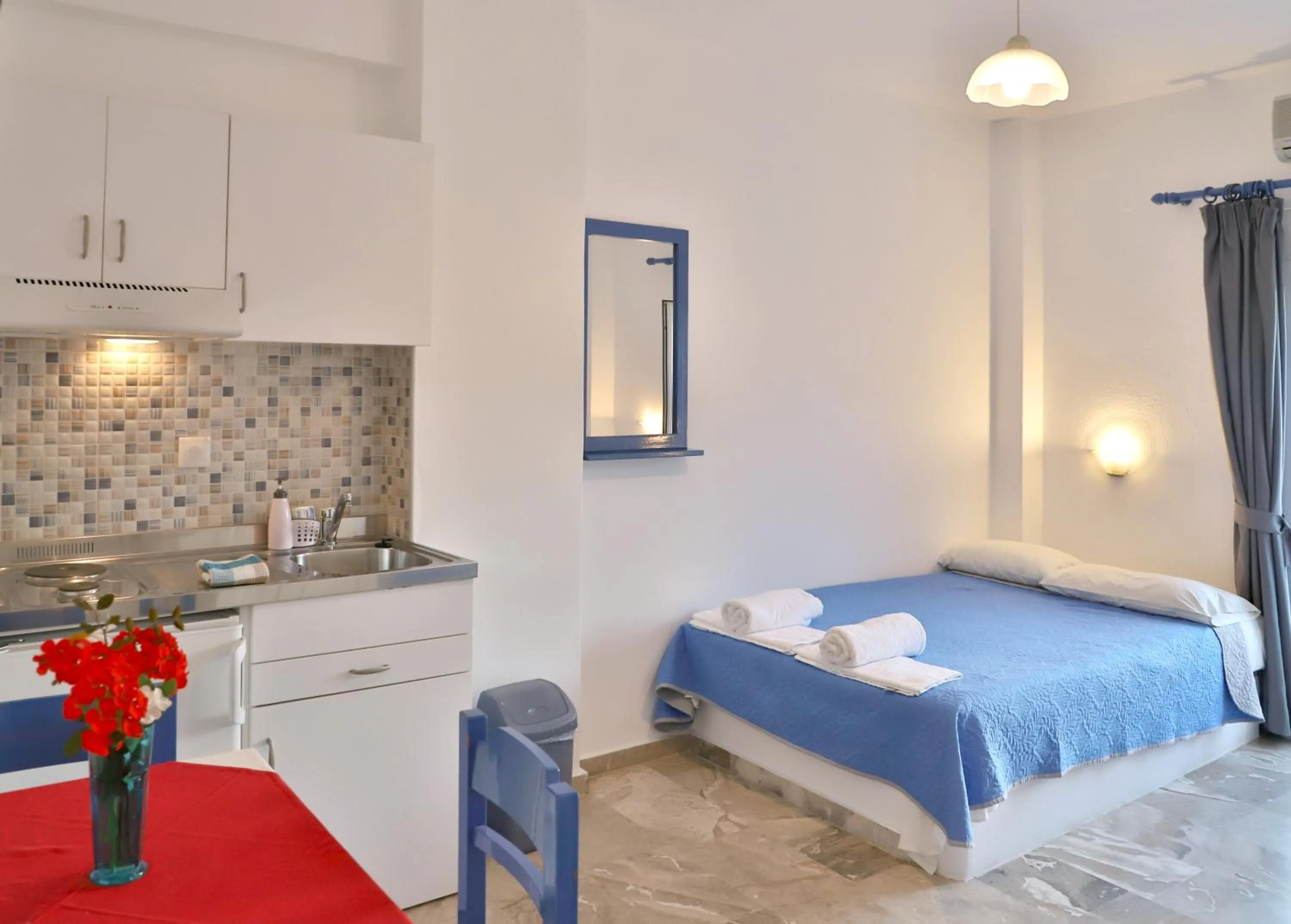 Bed in Helios Studios & Apartments