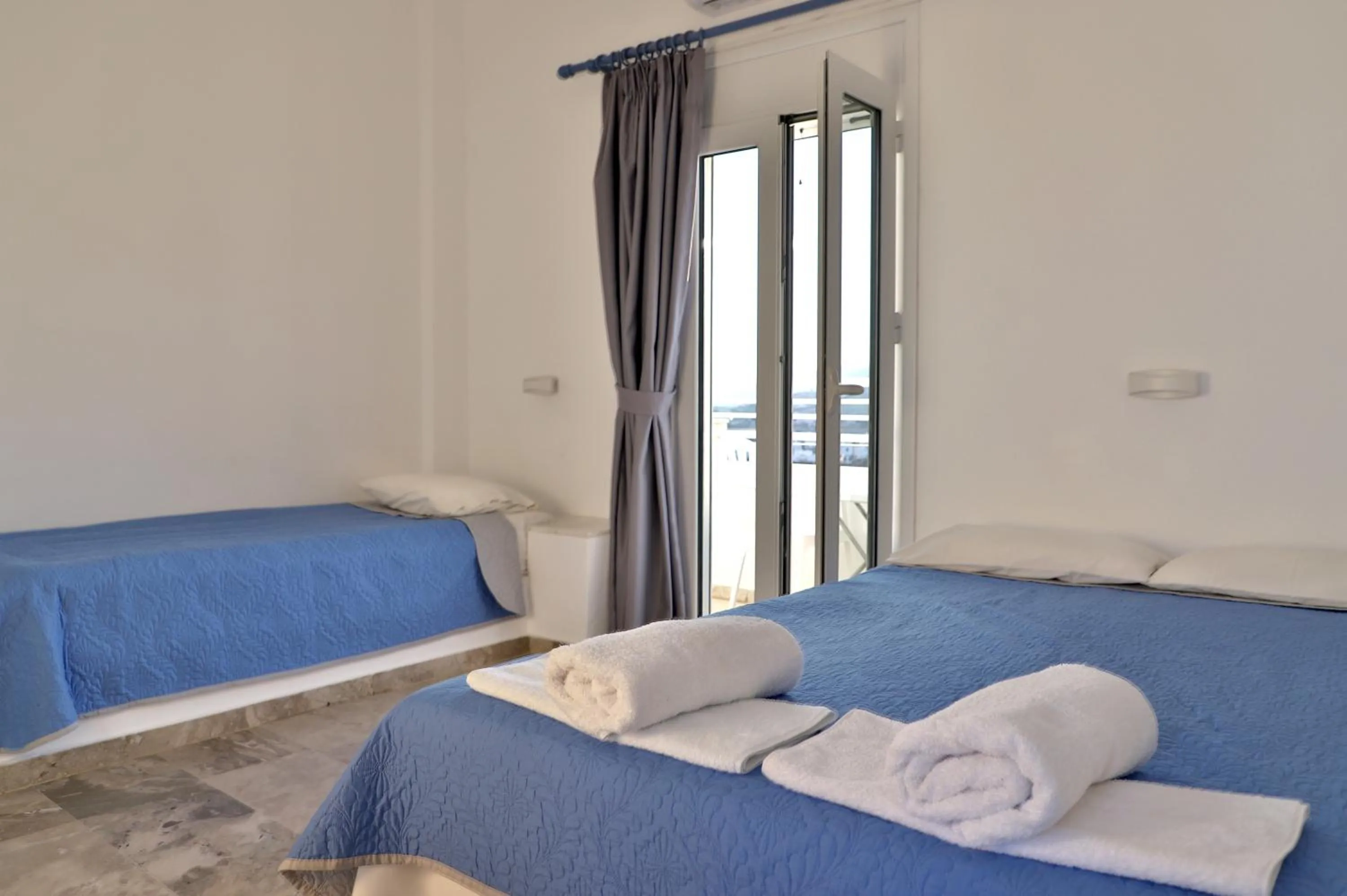 Bed in Helios Studios & Apartments