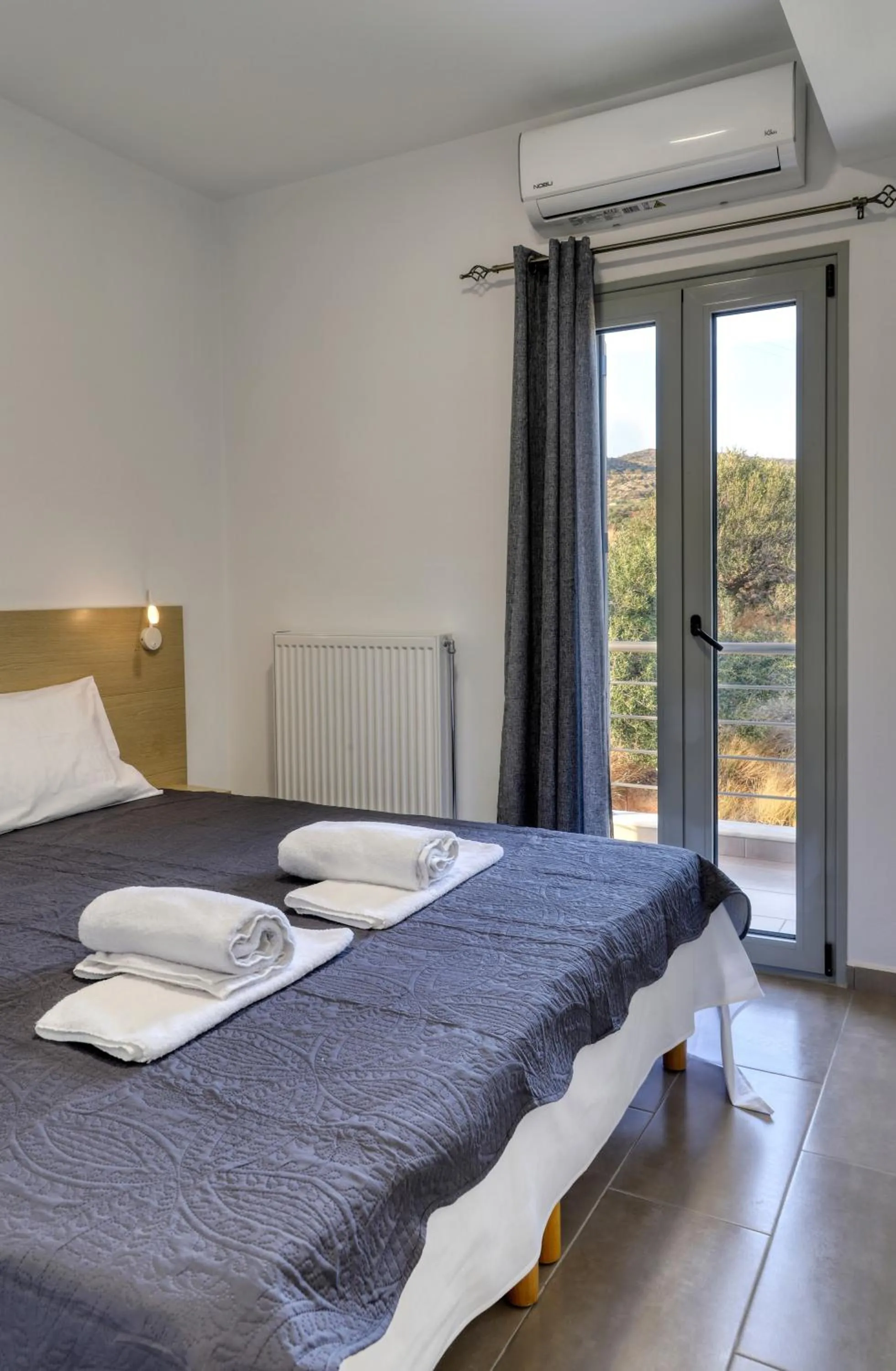 Bed in Helios Studios & Apartments