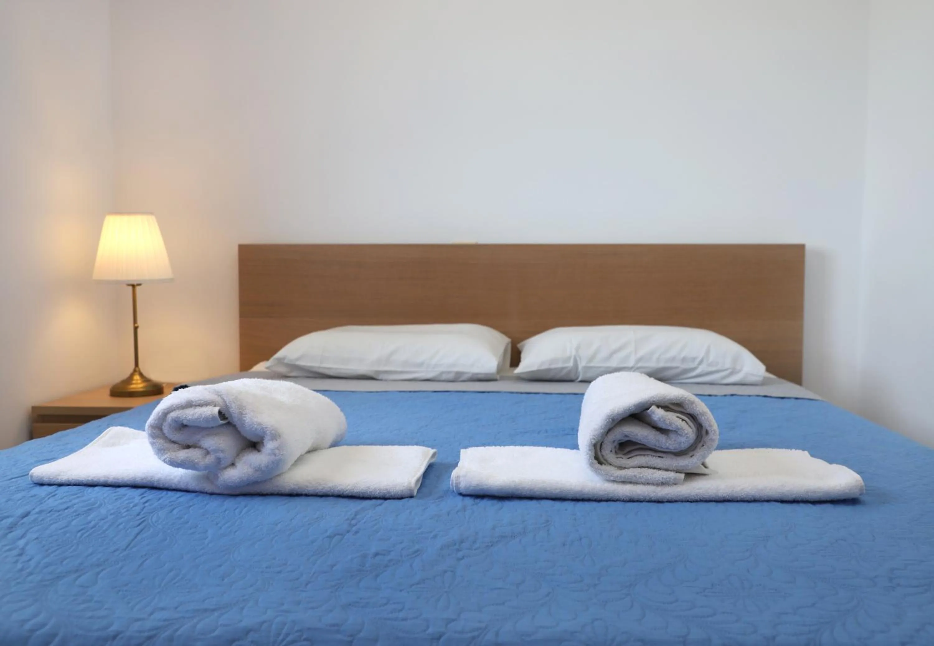 Bed in Helios Studios & Apartments