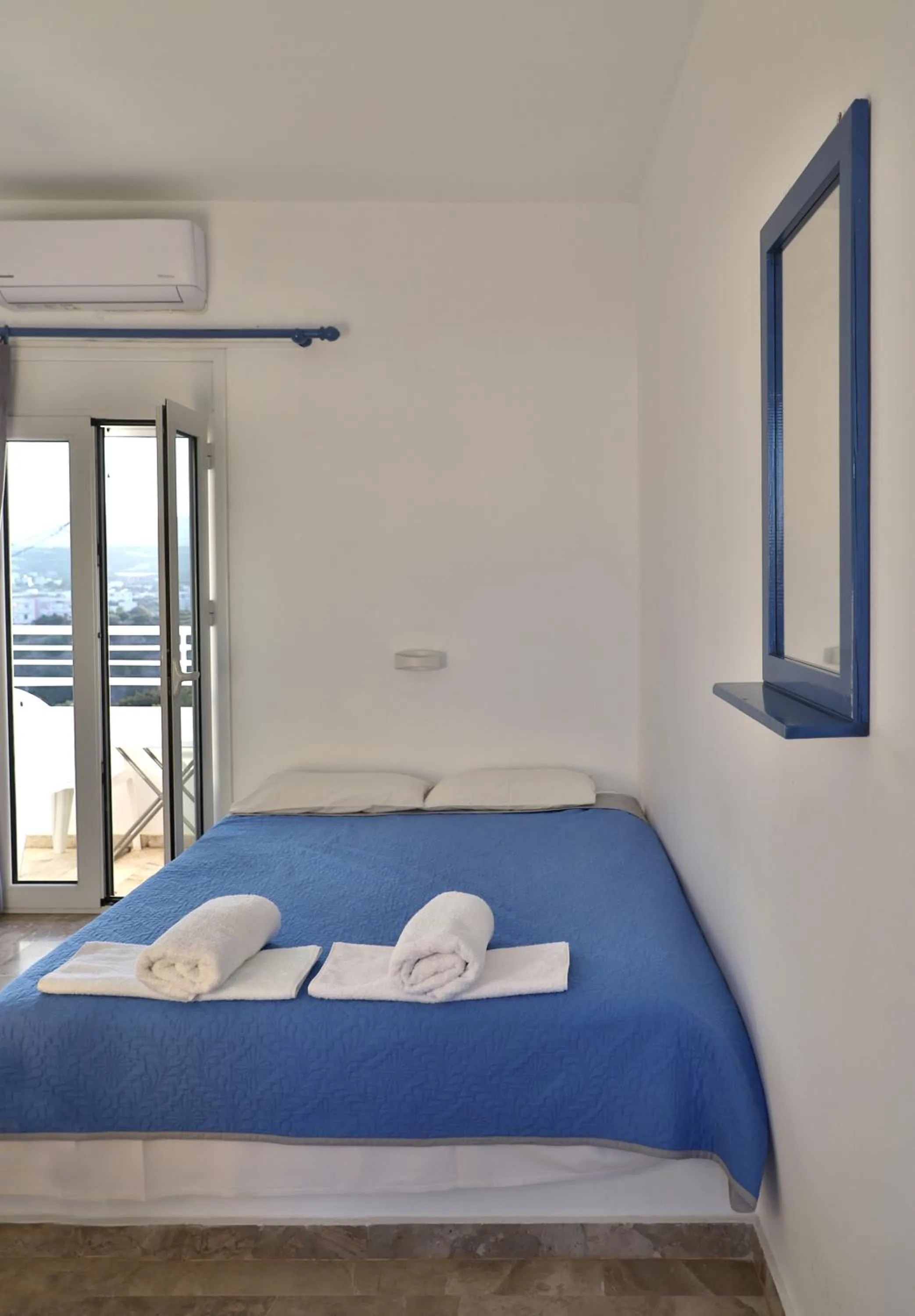 Bed in Helios Studios & Apartments