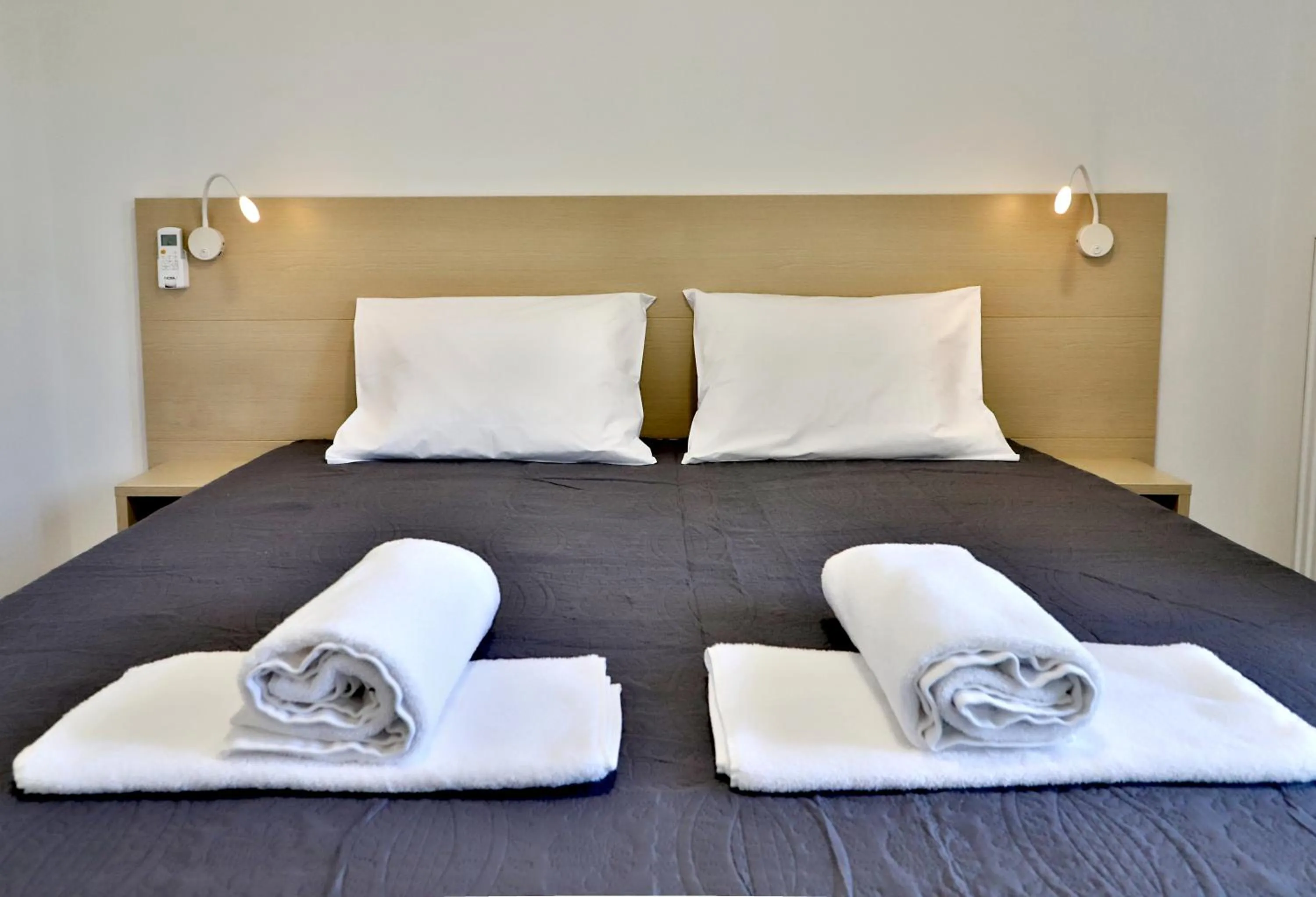 Bed in Helios Studios & Apartments