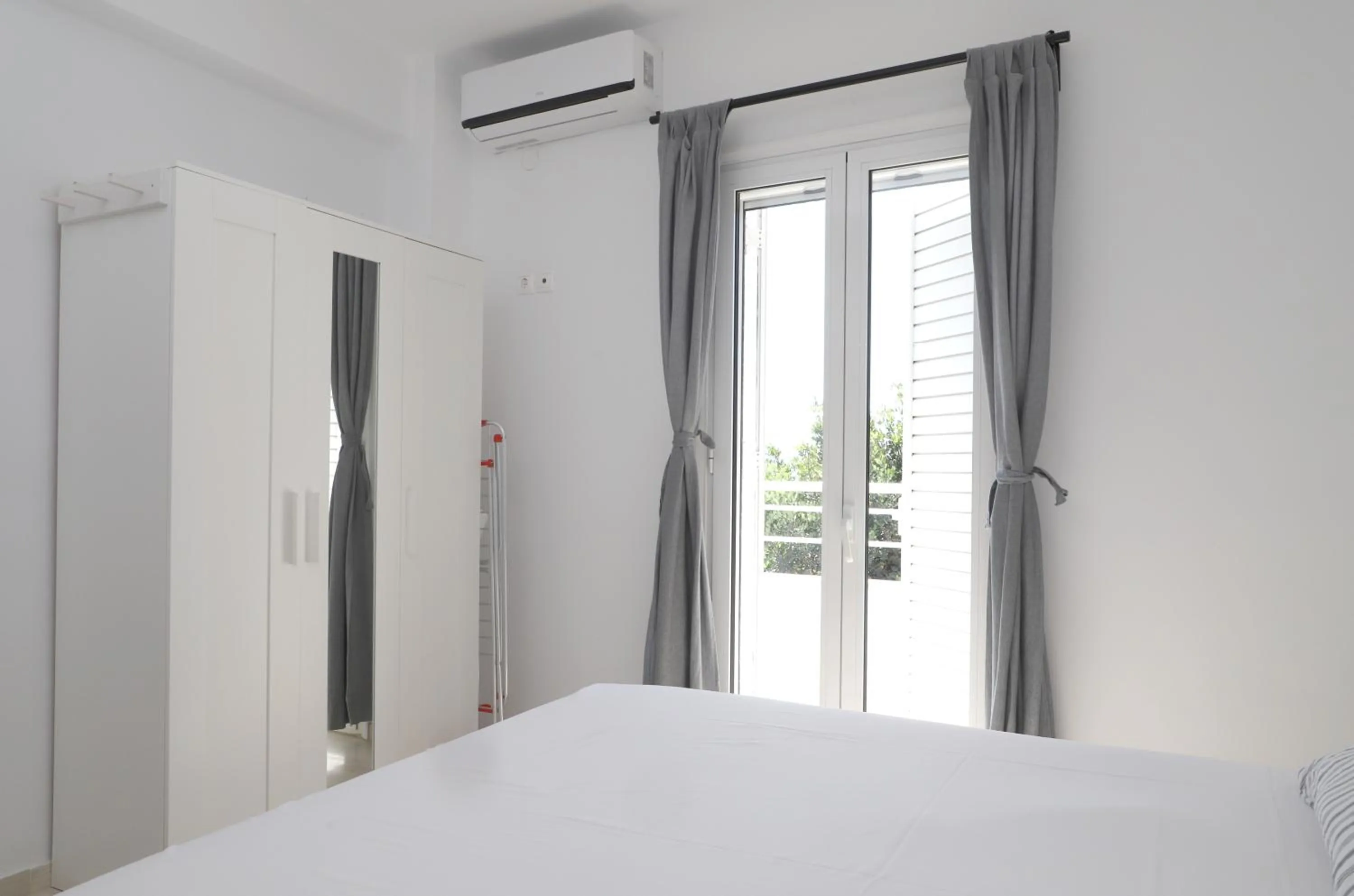 Bed in Helios Studios & Apartments