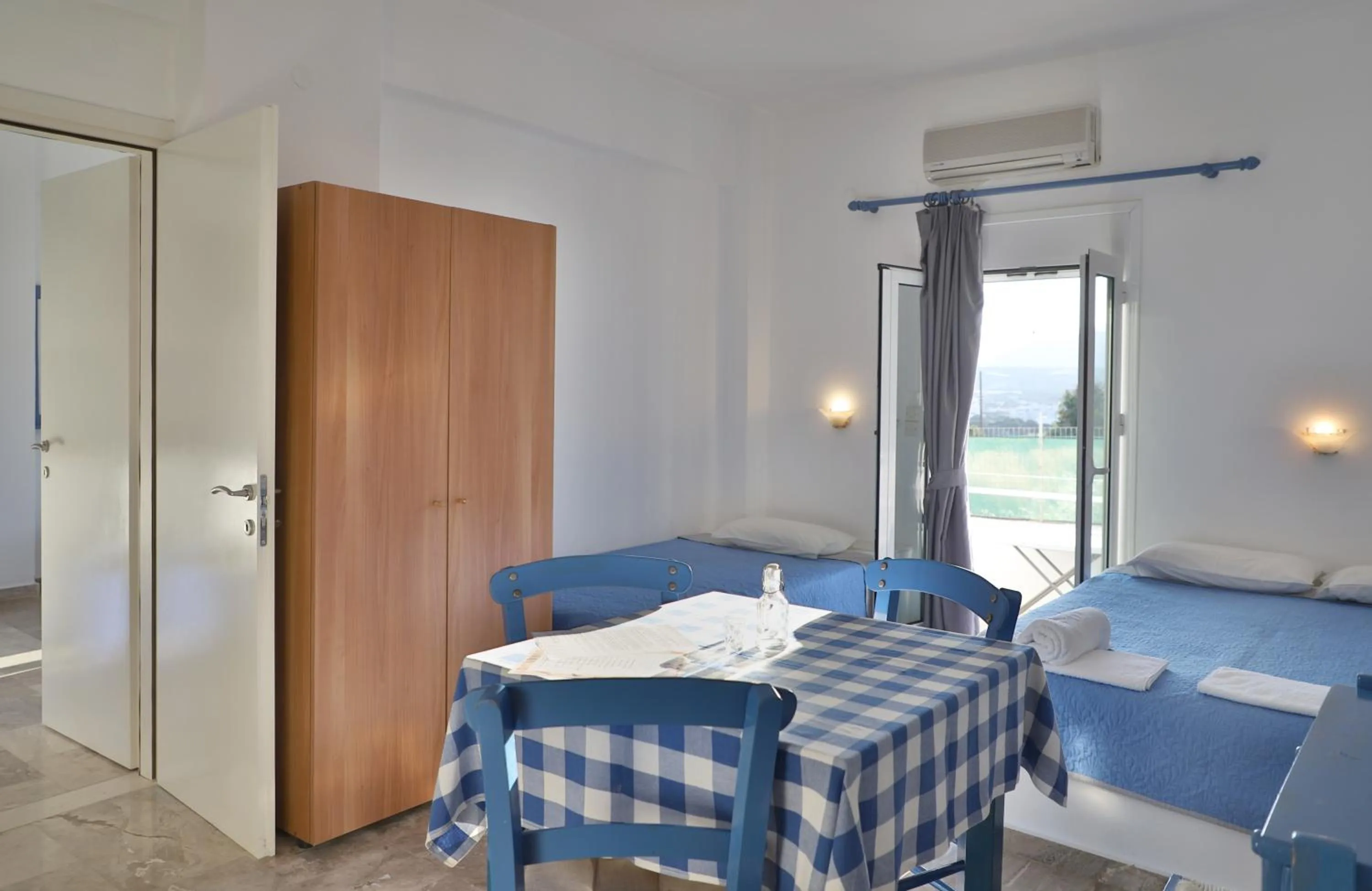 Bed in Helios Studios & Apartments