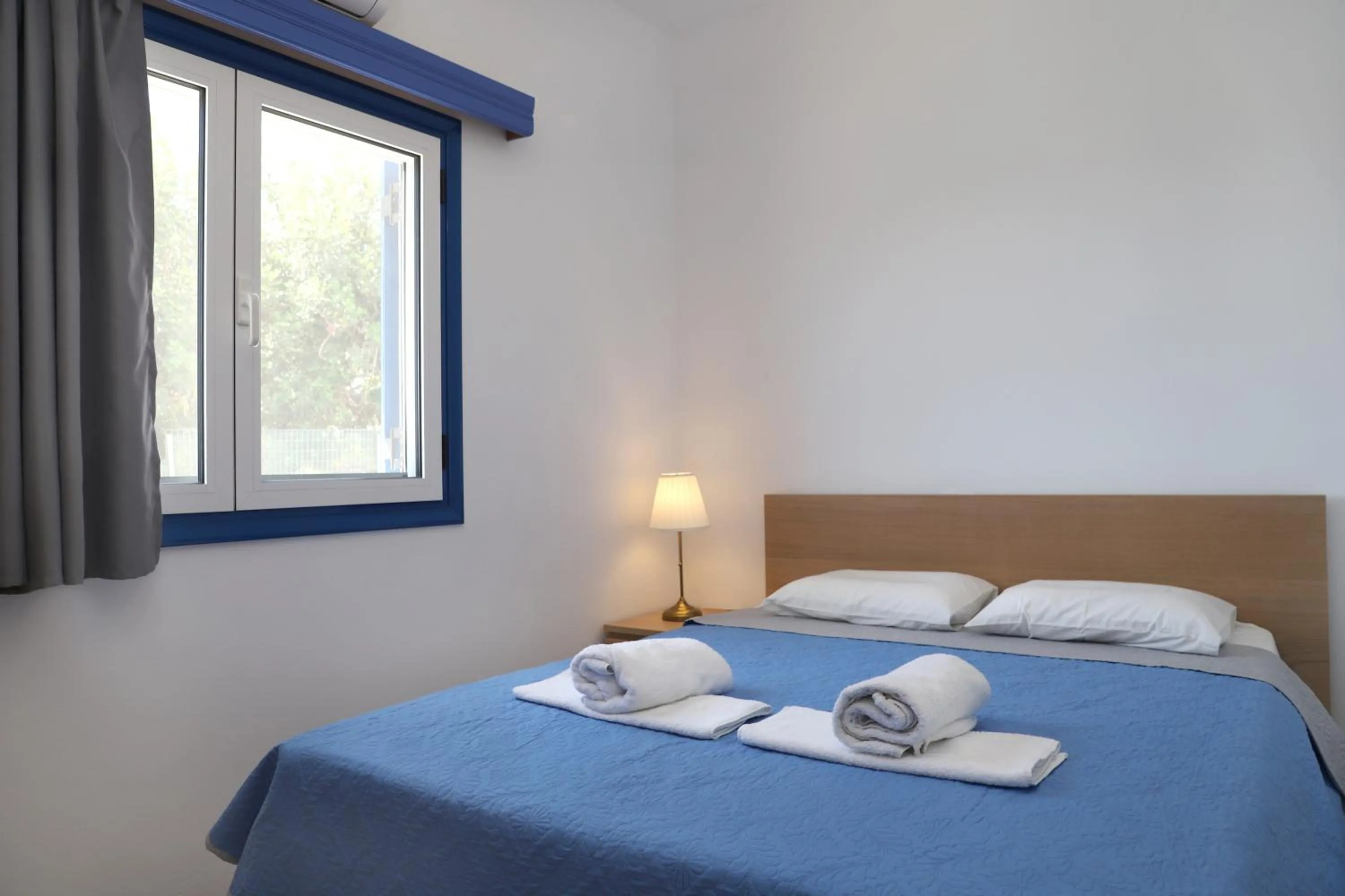 Bed in Helios Studios & Apartments