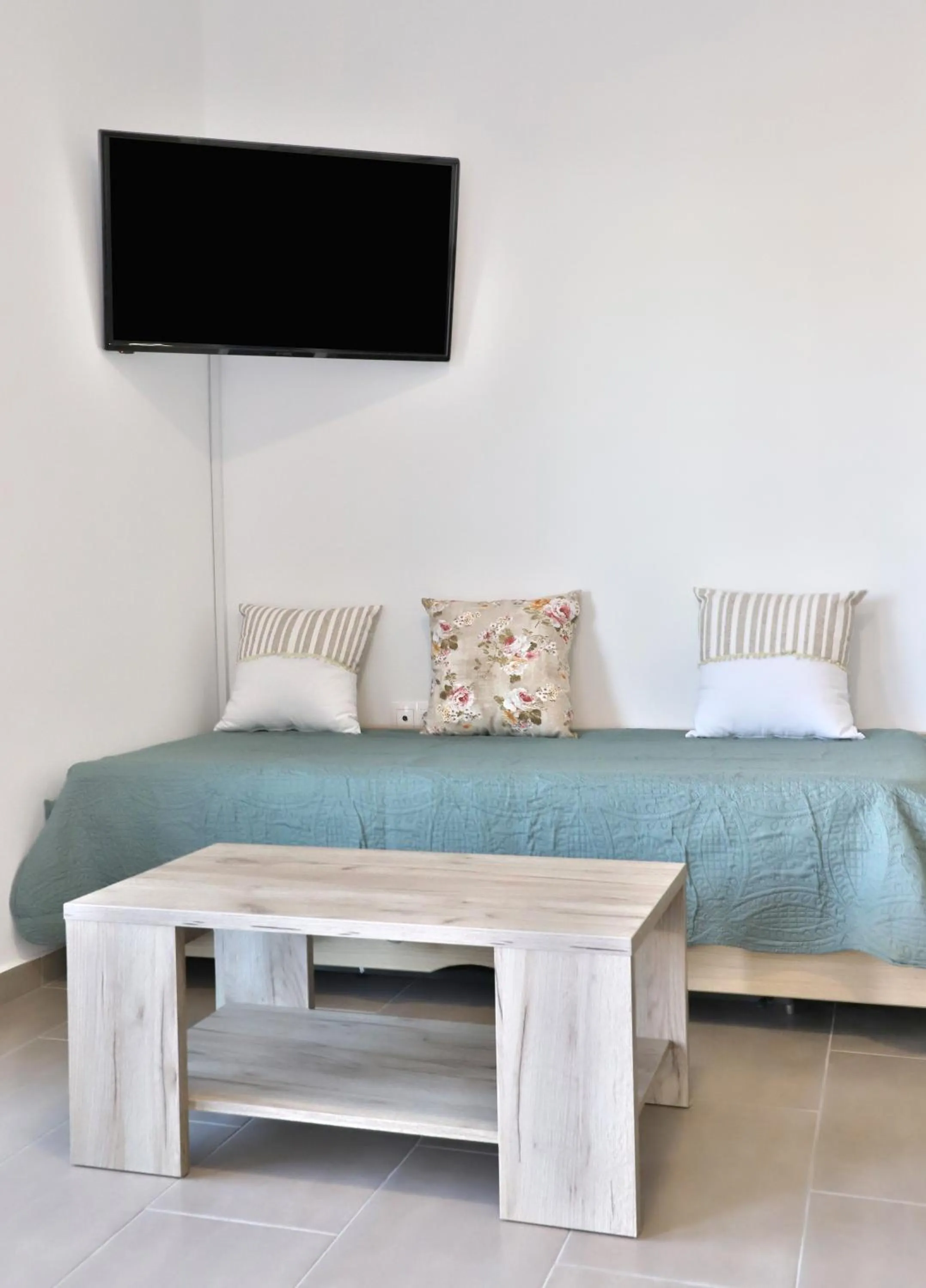 Bed in Helios Studios & Apartments